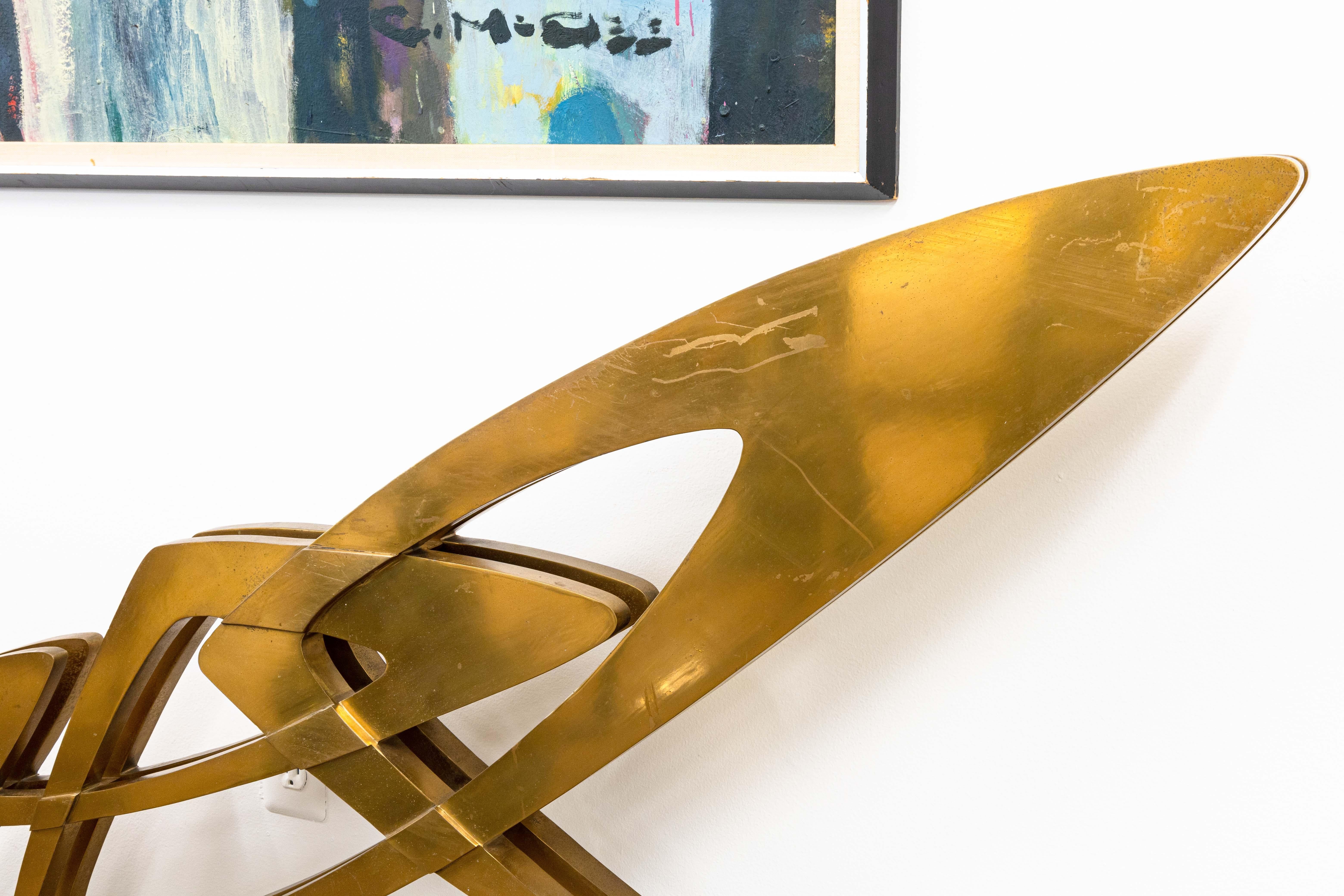 A bronze sculpture on lucite bases titled 