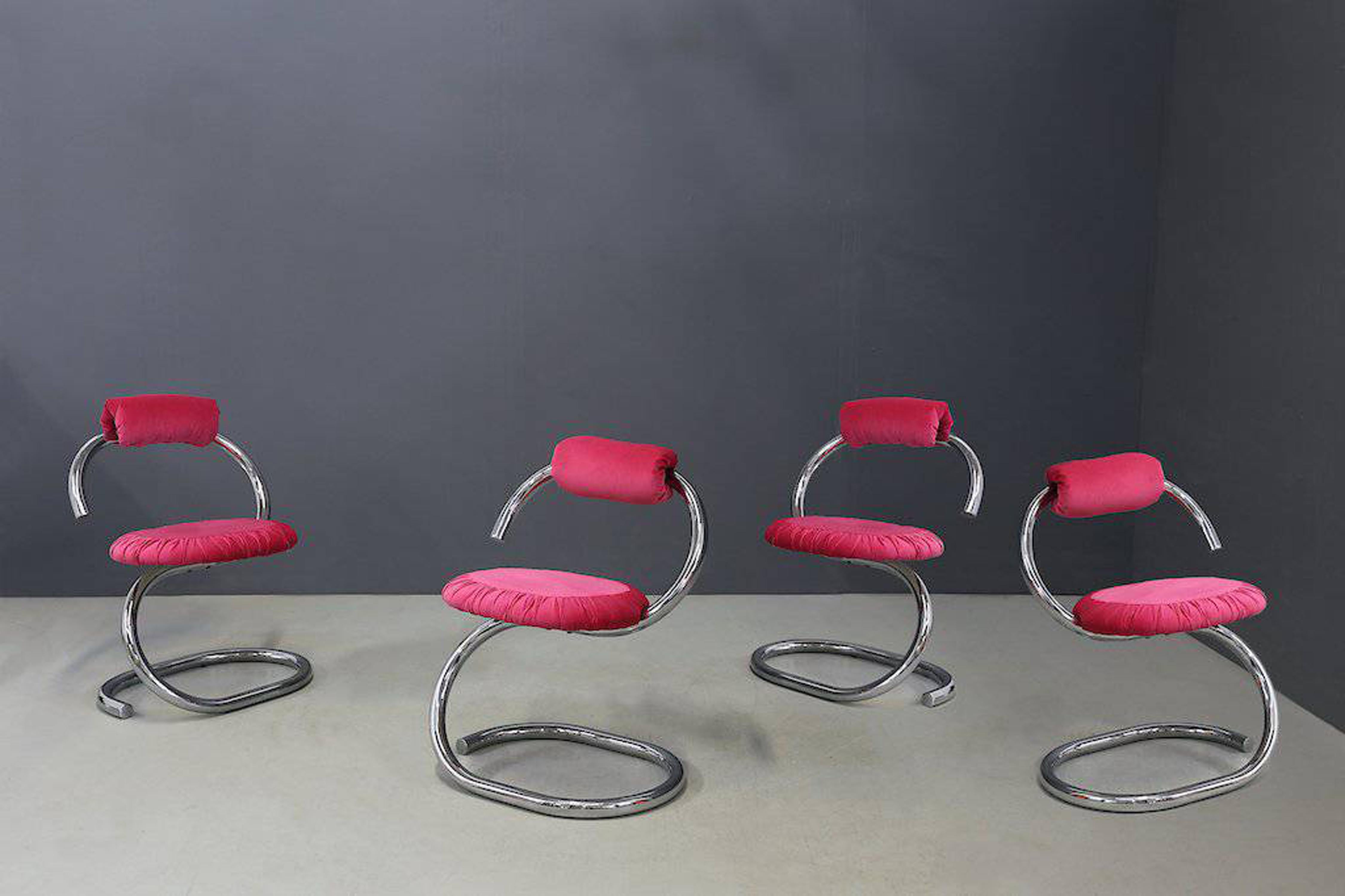 Cobra or Spirale chair designed by Giotto Stoppino in 1975.
The spiral and cantilevered chrome structure supports a seat and clip-on back cushion in vibrant fuchsia velvet. The seat has a charming pleated detail around the perimeter. 

These
