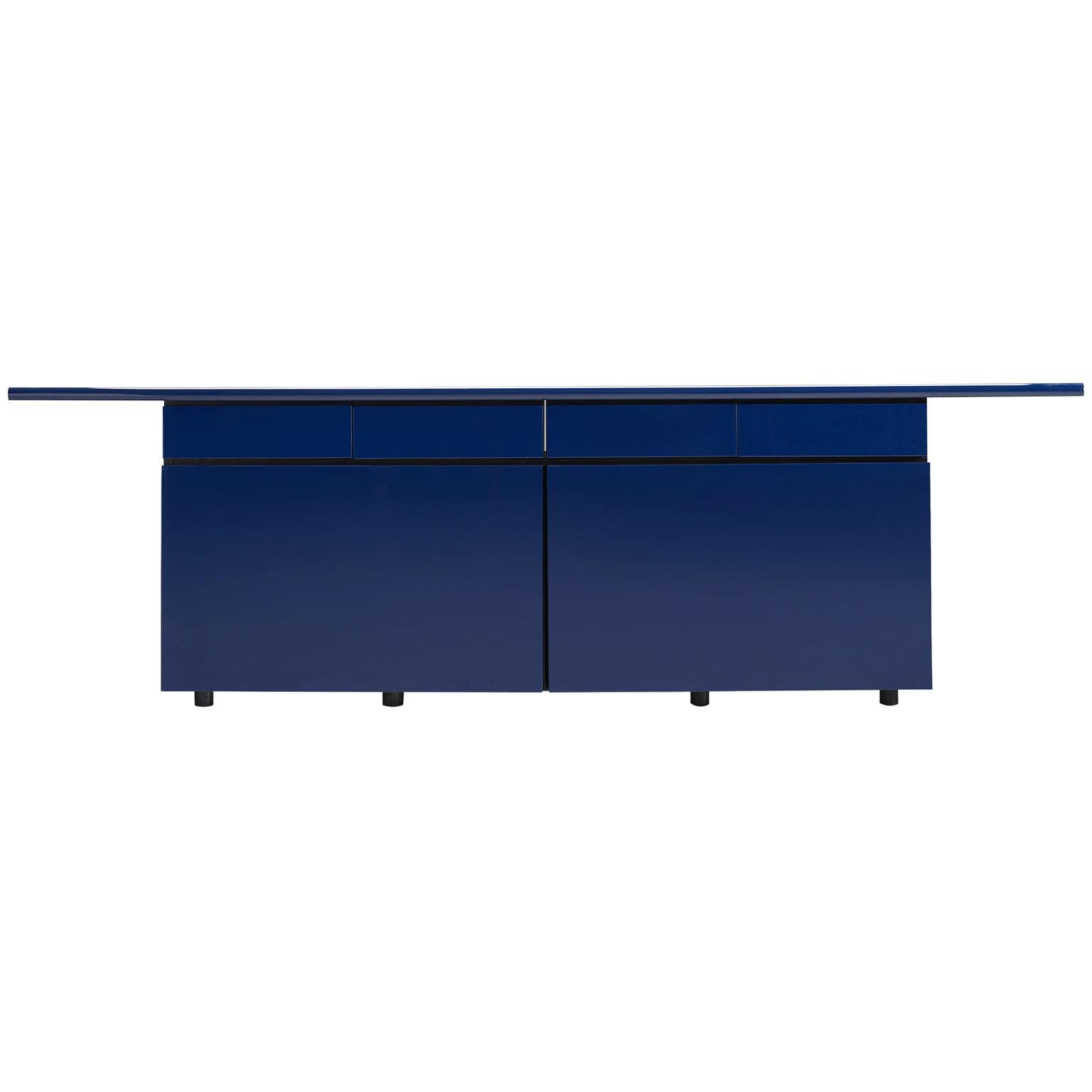 Giotto Stoppino for Acerbis, 'Sheraton' sideboard, blue wood, veneer, Italy, 1979.

This sturdy credenza with sliding doors is designed by Giotto Stoppino for Acerbis and executed in laminated wood. The eight little square legs make sure that the