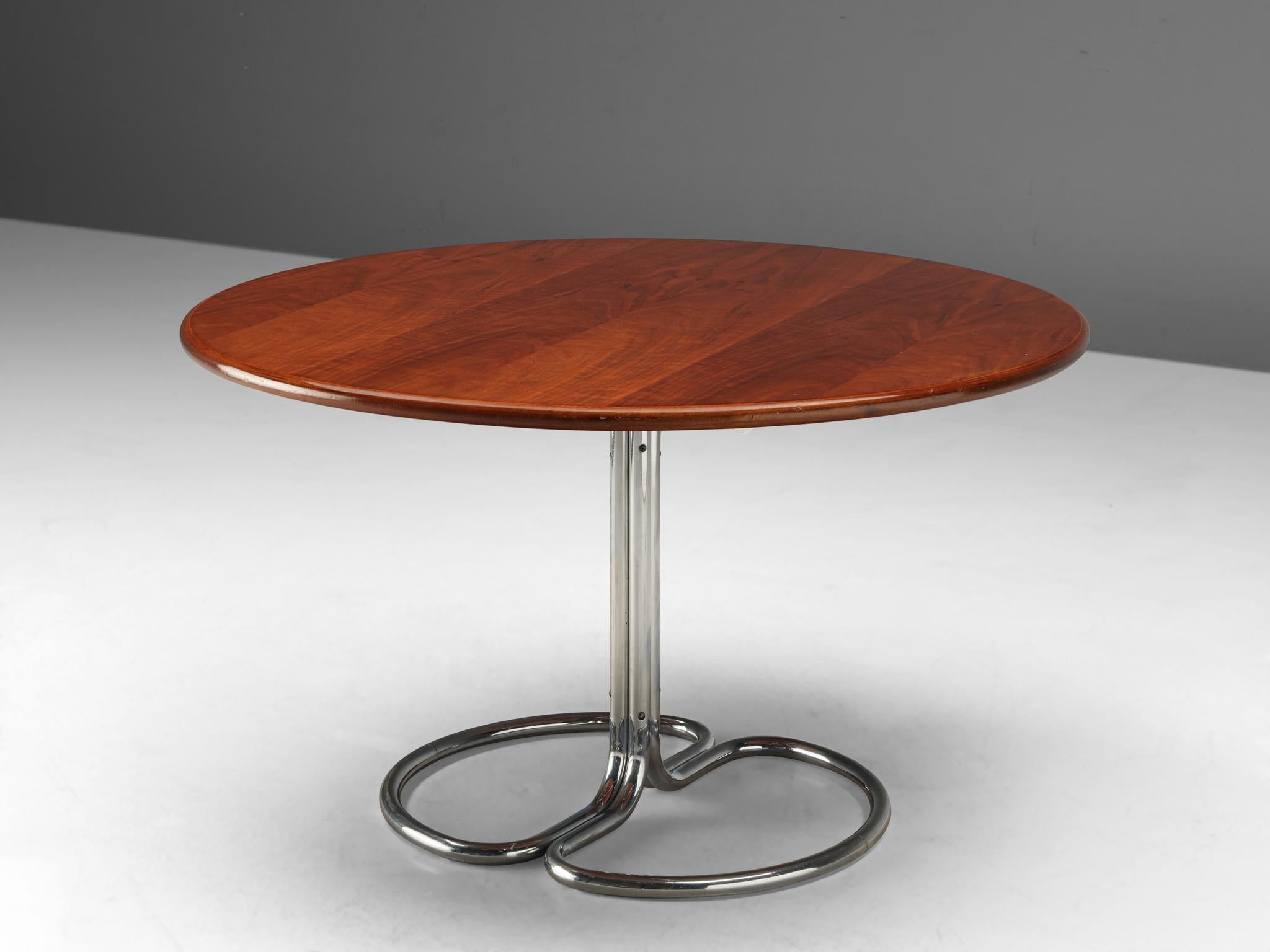 Giotto Stoppino for Bernini, 'Mayan' dining table, walnut and metal, Italy, 1960s

Round dining table by Giotto Stoppino. The walnut tabletop shows a warm, honey colored grain. It's supported by a chromed base that consists of to curved tubular