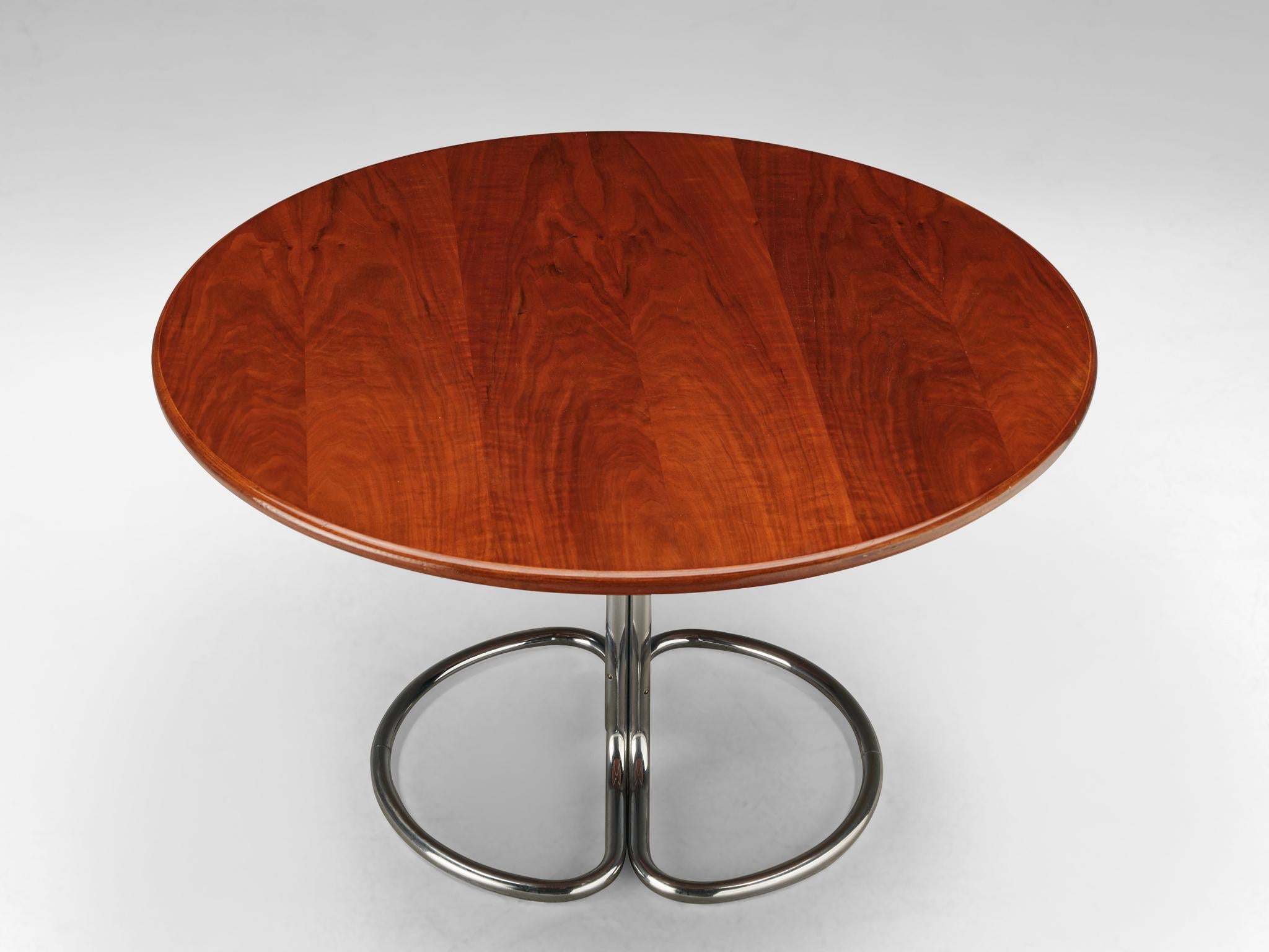 Giotto Stoppino for Bernini, 'Maia' dining table, walnut and chromed metal, Italy, 1960s

Round dining table by Giotto Stoppino. The walnut tabletop shows a warm, honey colored grain. The top is supported by a four-part chromed base that consists of
