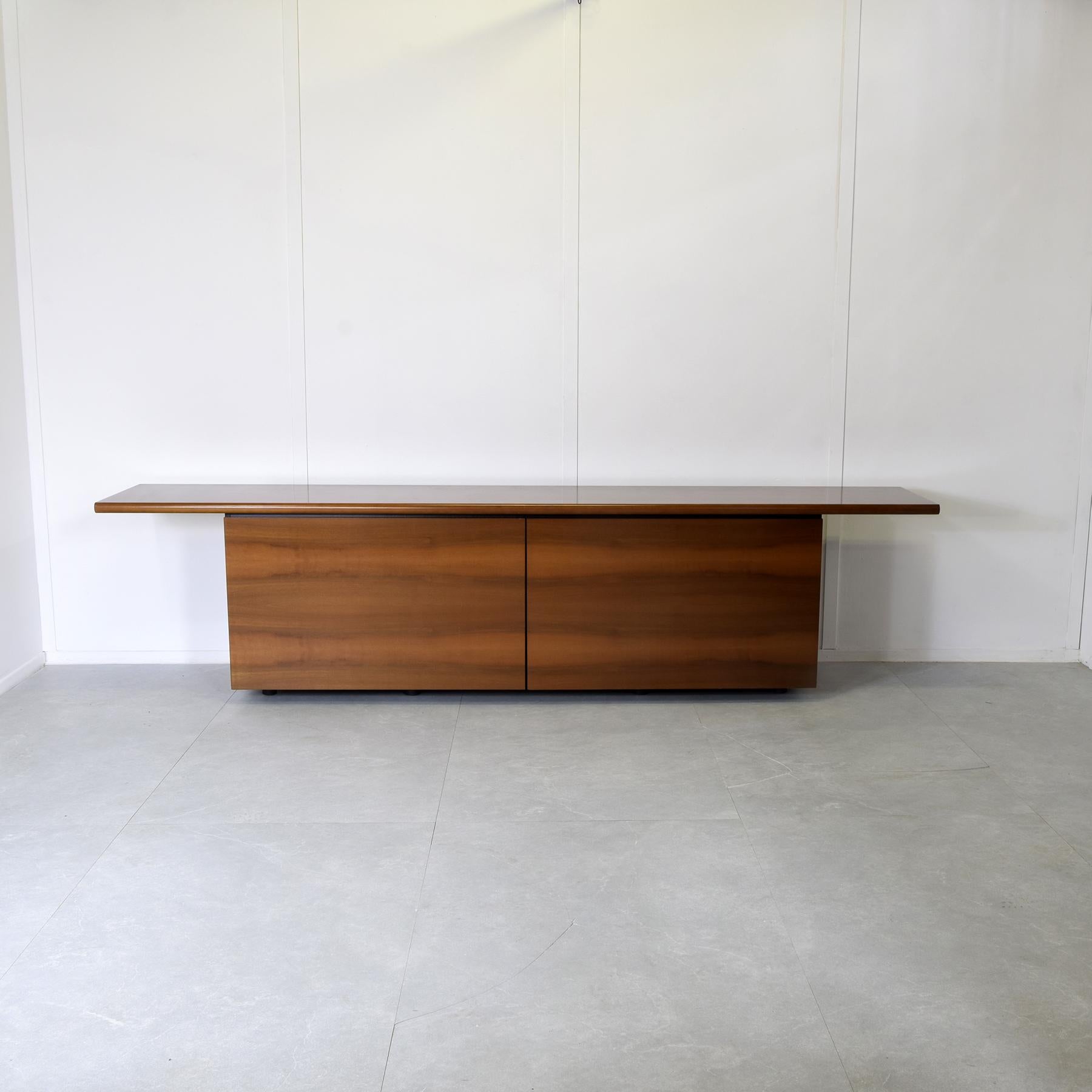 Sheraton sideboard by Lodovico Acerbis and Giotto Stoppino for Acerbis International.
Wood frame, chrome metal details and clear glass shelves. Features 3 glass shelves and 4 drawers.
When you purchase vintage design products on our website, the