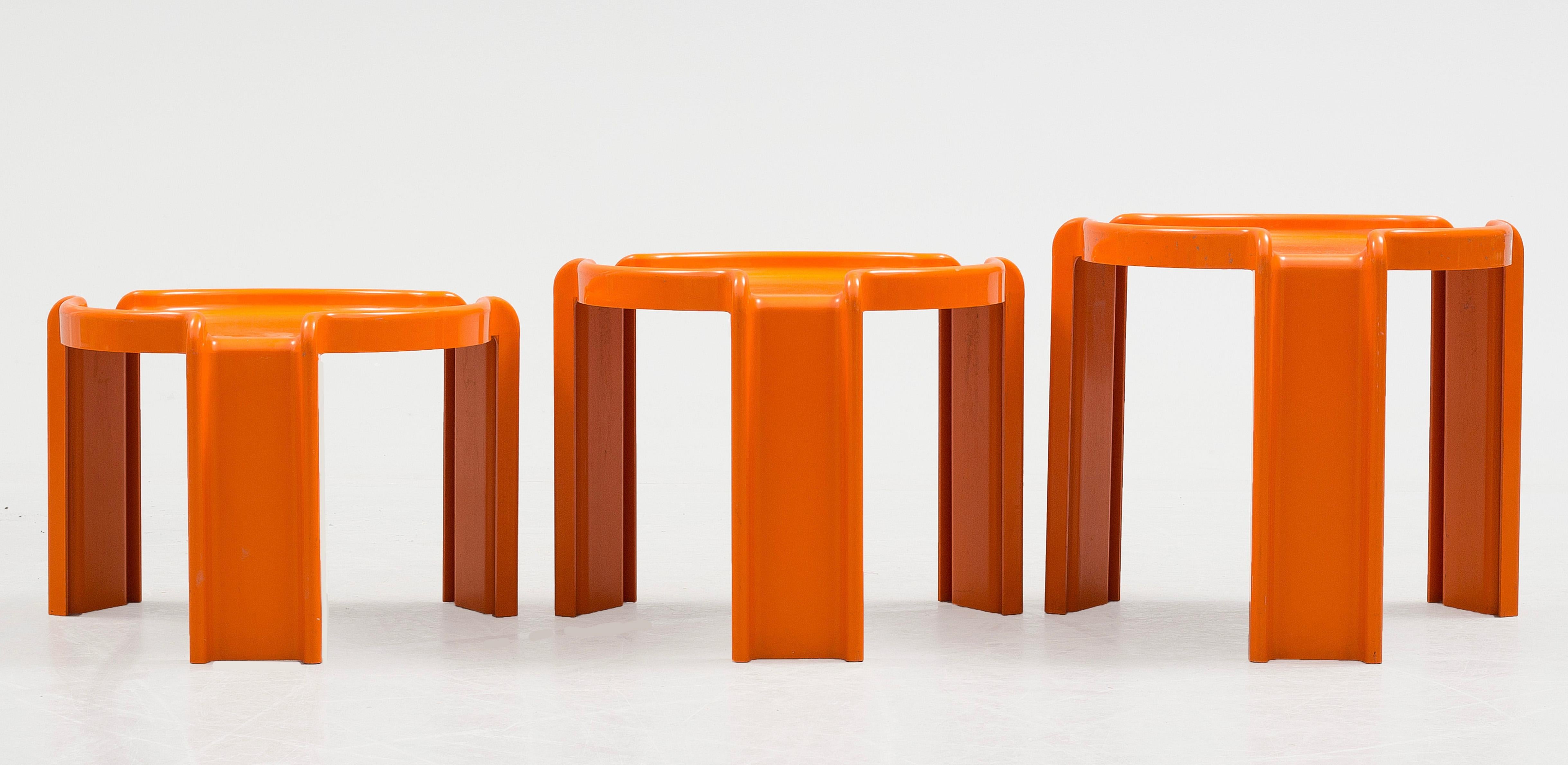 Giotto Stoppino designed for Kartell this unique set of coffee tables in 1968 and chose to make them orange, a common color in Italy during the 1970s which makes them even more appealing. 

Excellent for use as coffee tables or emergency snacks,