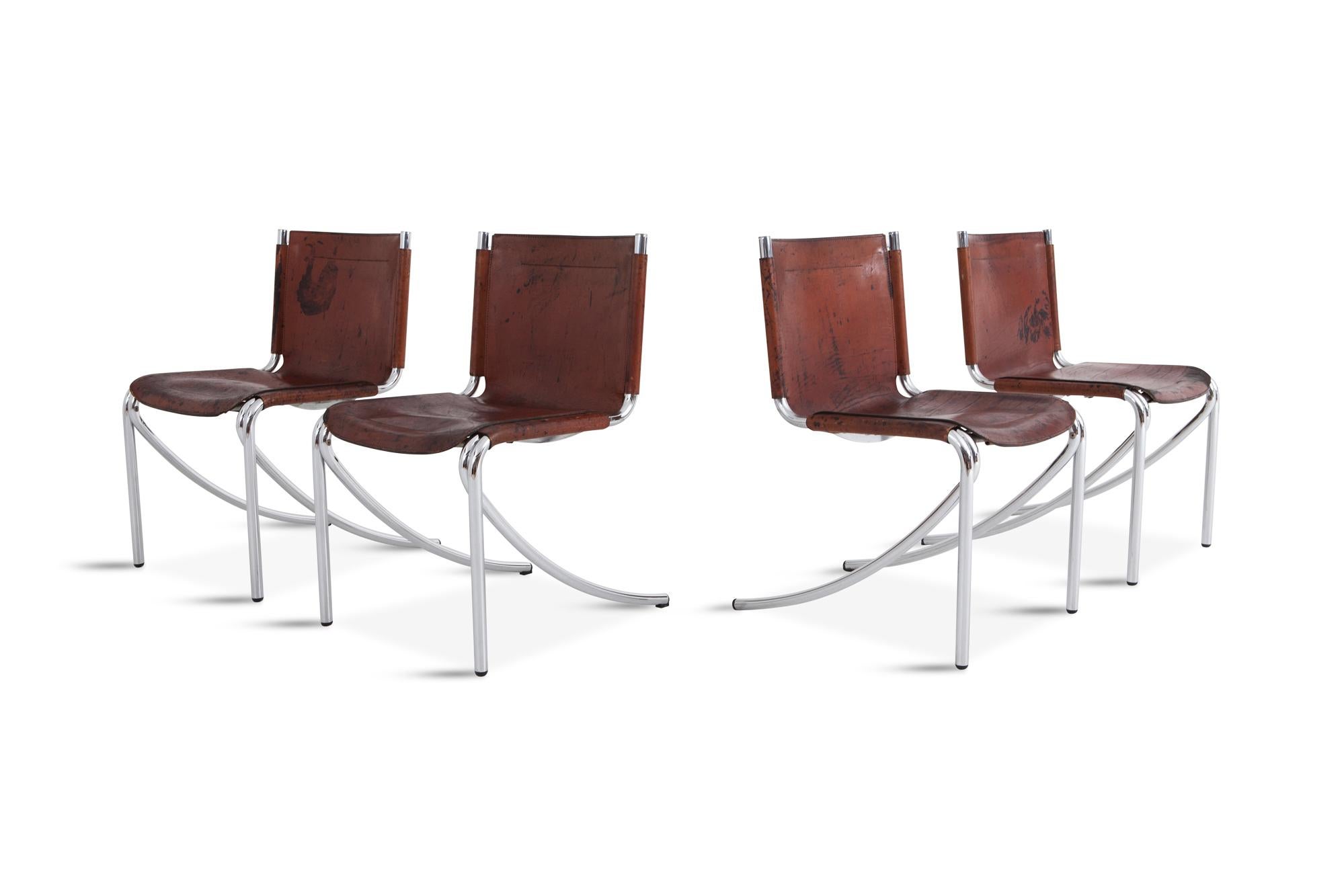 Acerbis in Italy manufactured these Jot chairs designed by Giotto Stoppino.

Stunning patina on the leather adds tons of character on these oxblood leather chairs.
The chrome frame is also still in really good condition.