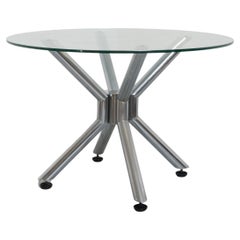 Giotto Stoppino, Round table in beveled crystal with tubular steel frame.