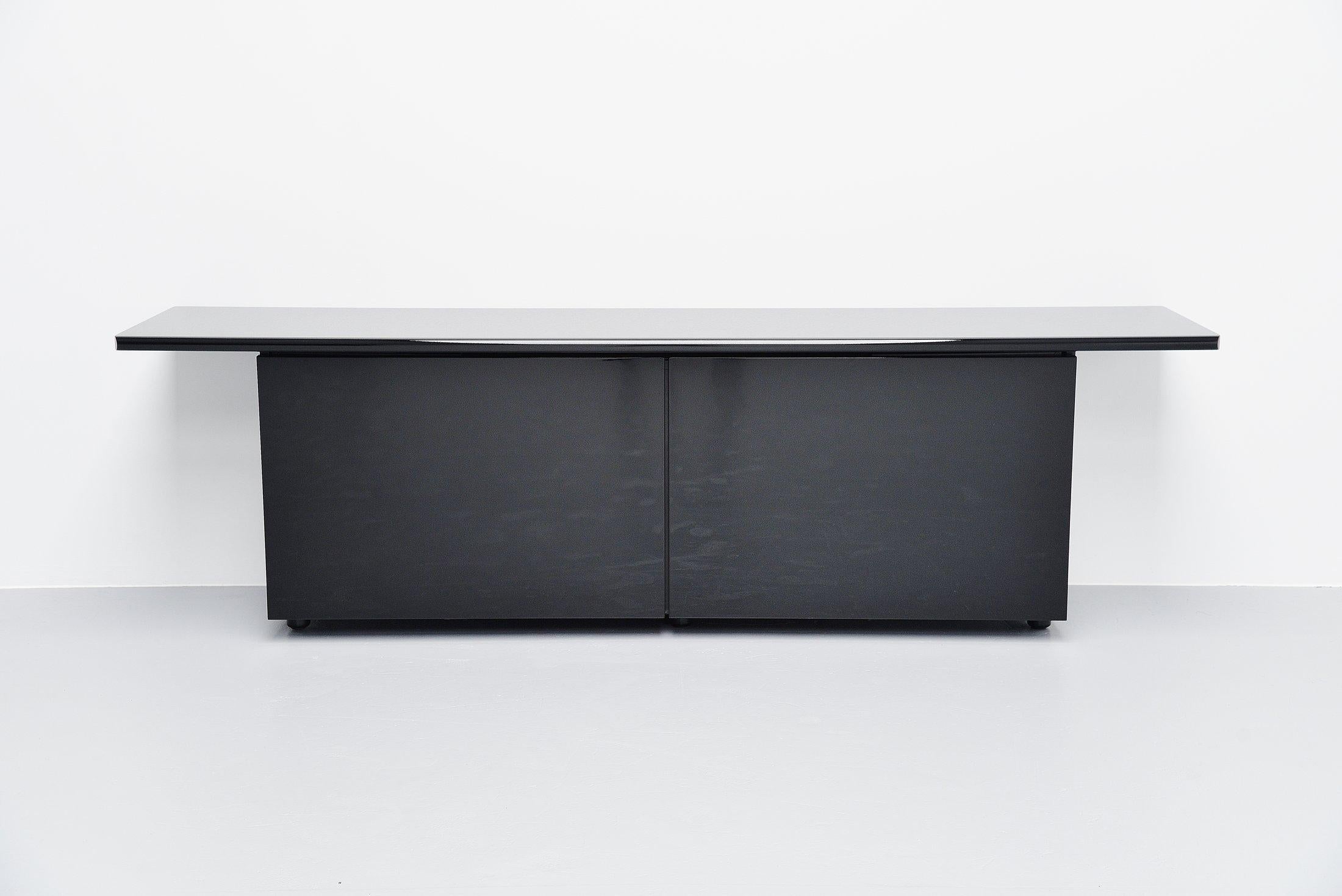 High quality credenza named 'Sheraton' designed by Giotto Stoppino and Lodovico Acerbis and manufactured by Acerbis International, Italy, 1977. This is for a black gloss version in very good condition. The credenza has 2 sliding doors with shelves