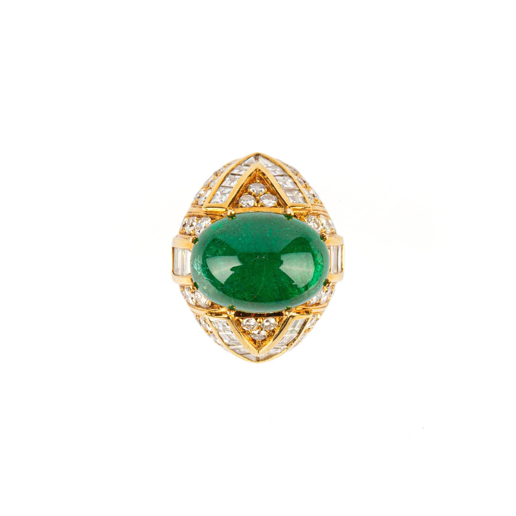 A refined ring showcasing a fine cabochon emerald (appx. 9 cts) mounted in 18k yellow gold with baguette and round-cut diamonds, by Giovane. Made in Italy, circa 1980