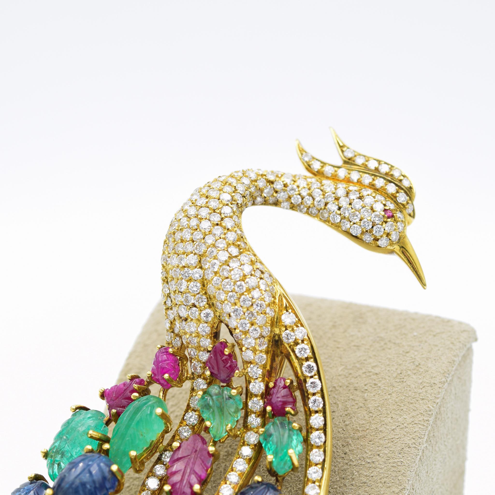The house of Giovane has forged its name with exquisite jewelry crafted in one of Italy's oldest and most esteemed workshops. This peacock brooch was made in 18 karat gold and is adorned with beautiful diamonds and gemstones. Stamped 3224 AL Giovane