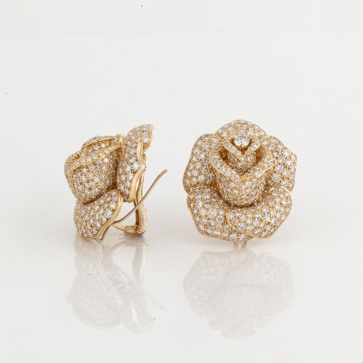 Giovane earrings depicting roses composed of 18K yellow gold with pavé round brilliant-cut diamonds.  They contain 672 round diamonds that total 24.50 carats; G-H color and VS-SI clarity.  Measure 1 3/8 inches long, 1 1/4 inches wide and 1/2 inch