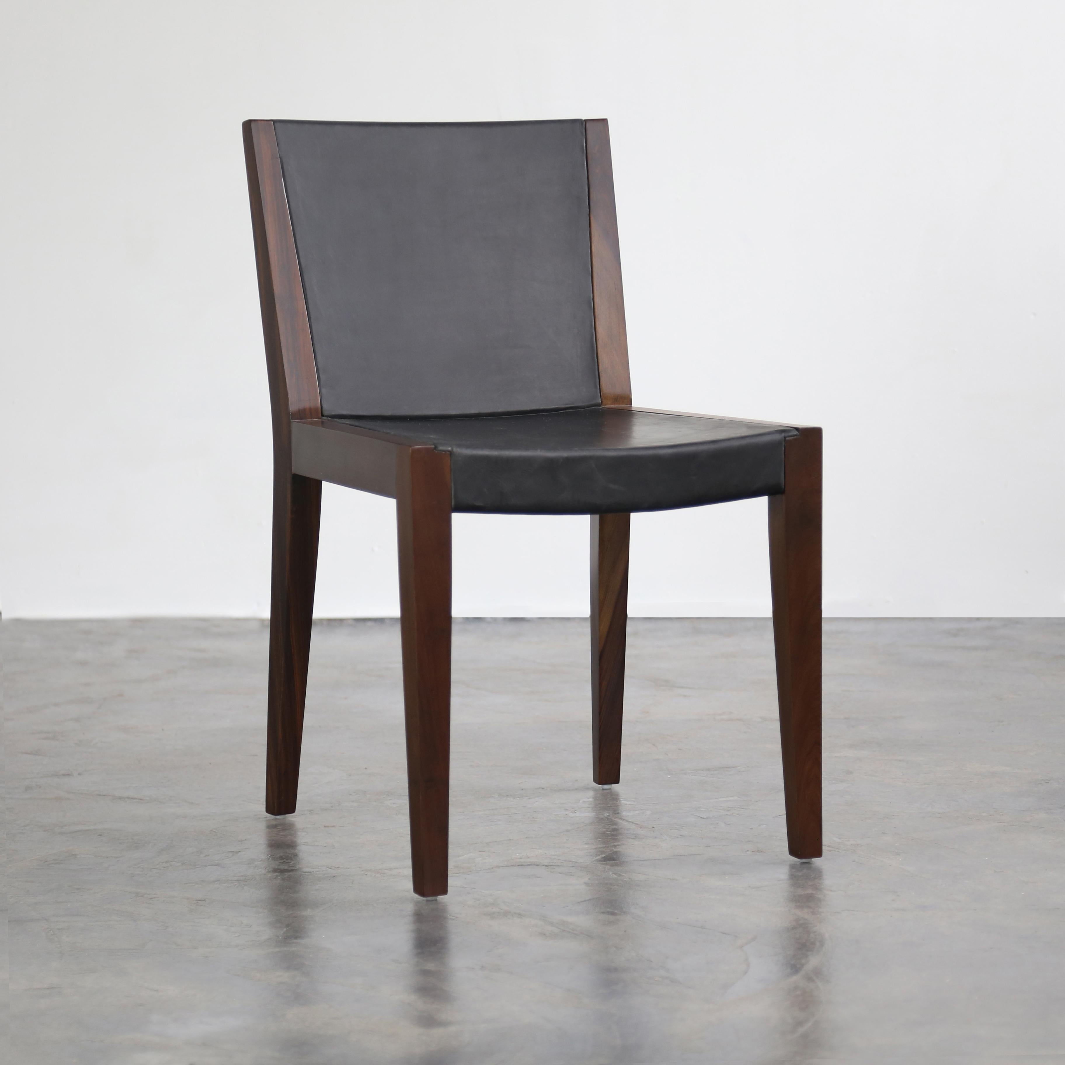 The Giovanni Chair is a decidely modern take on traditional woodworking methods. The gently curved, solid wood frame is partially wrapped in the leather of your choice to create a subtle dialogue between these two contrasting, yet rich