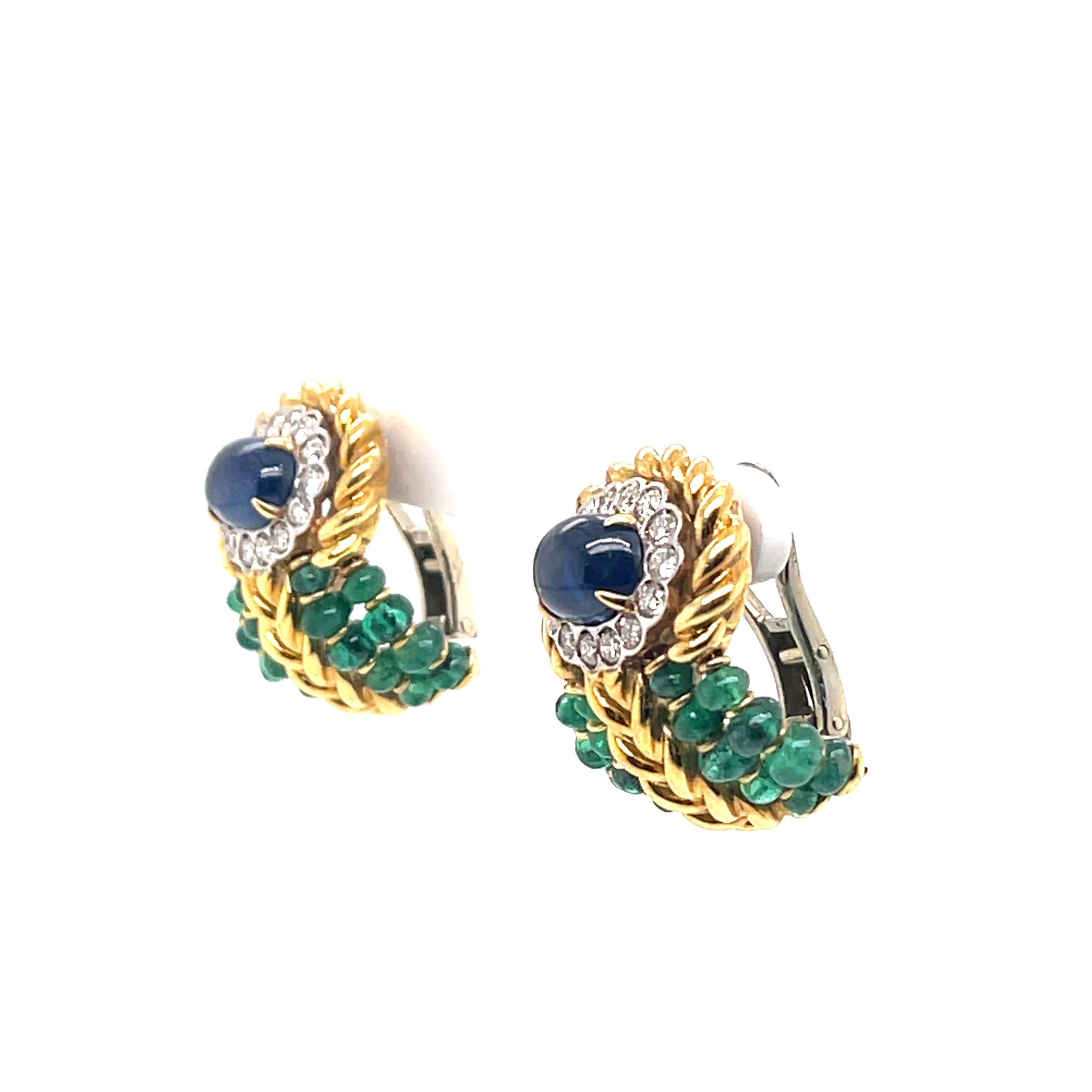beautiful earrings featuring emerald beads and a beautiful sapphire 