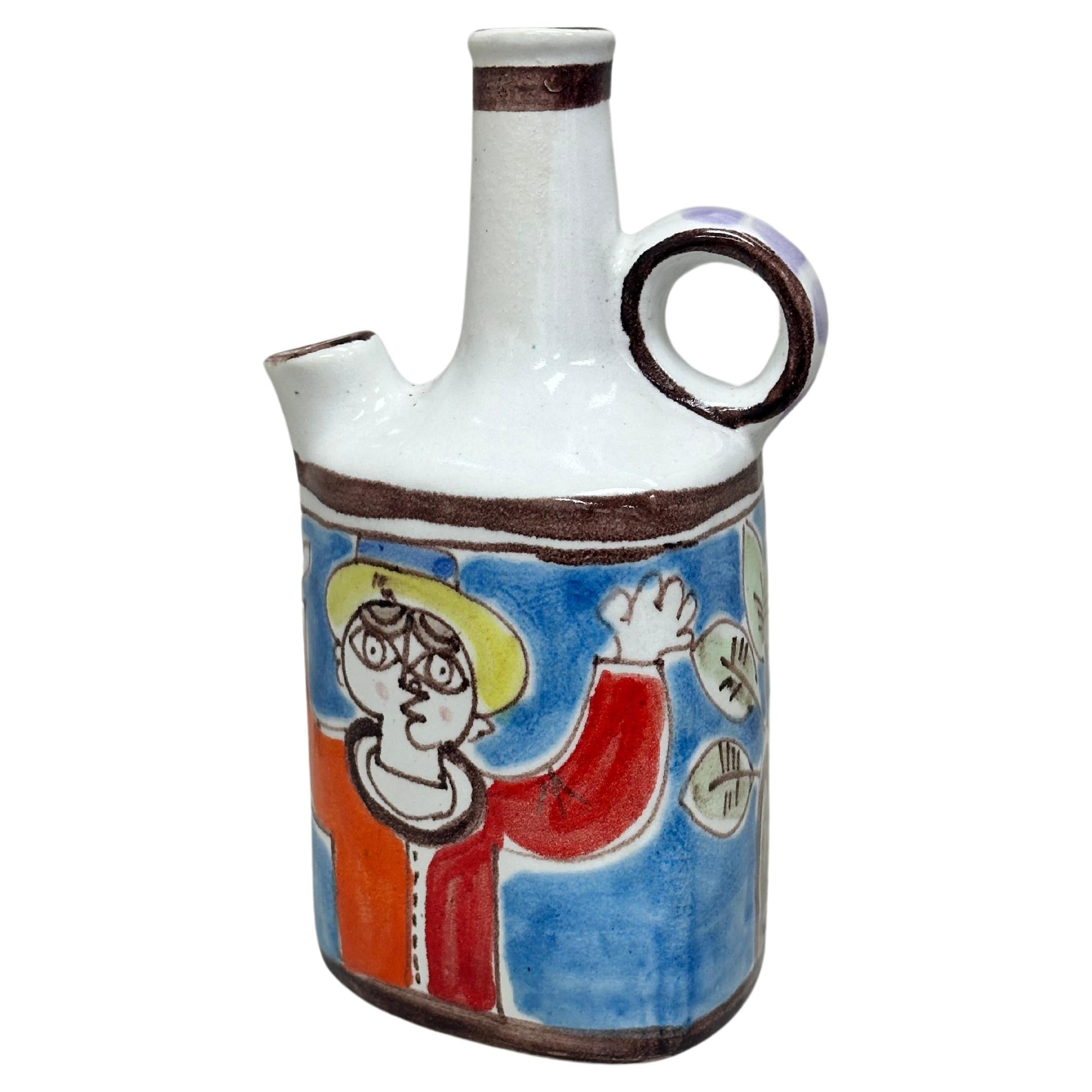 Giovanni de Simone Hand-Painted Jug Vase

This three-sided handled jug vase by famed Italian artist Giovanni de Simone (1930-1991) is an original gem. The vase features several colorful hand-painted portraits in the style of Picasso. The base of the