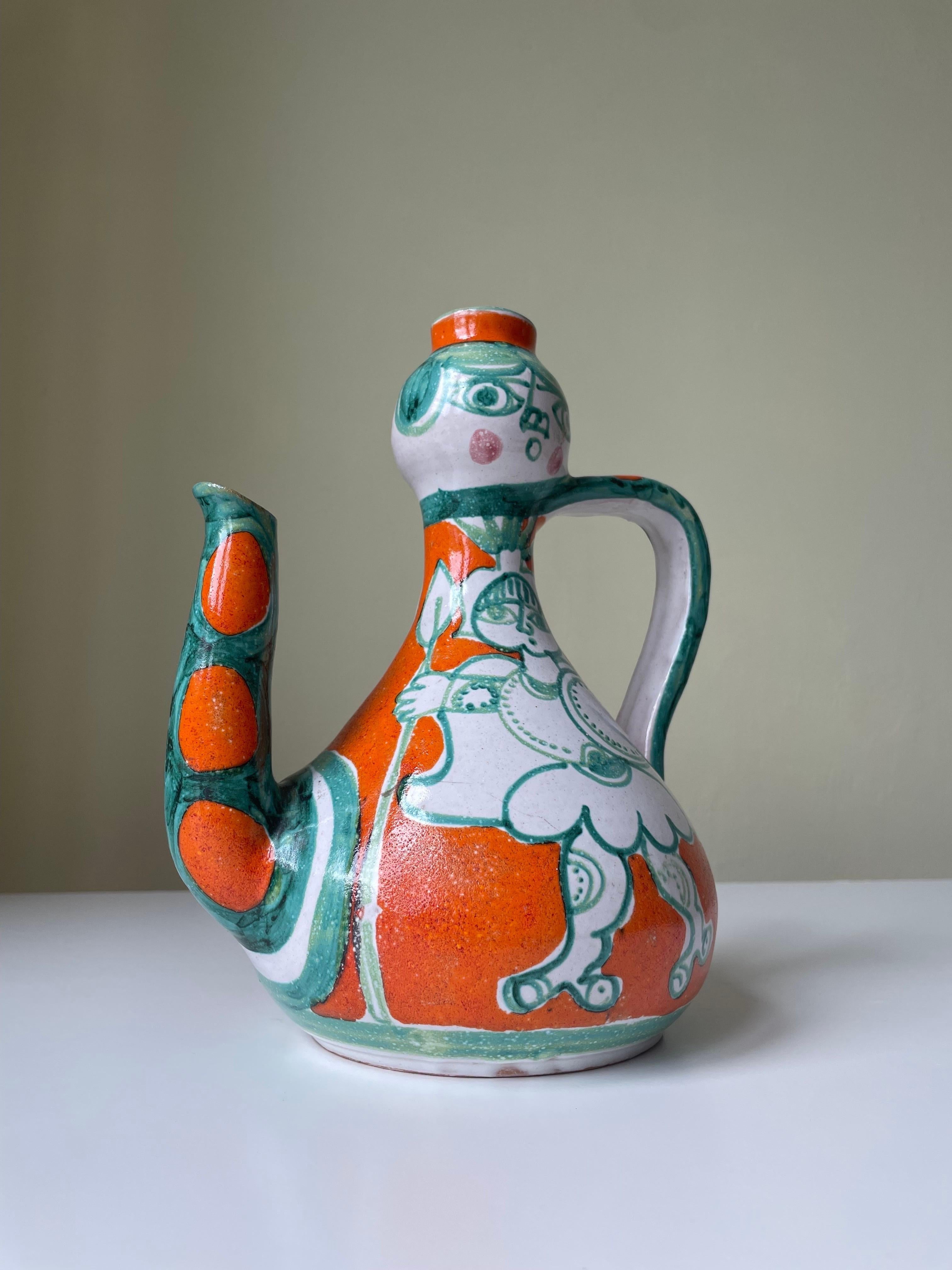 Sicilian soft shaped ceramic bottle pitcher vase with handle and spout designed and handmade by ceramic artist Giovanni De Simone (1930-1991) in 1964. De Simone studied under the direction of Pablo Picasso by whom he was highly inspired. The pitcher