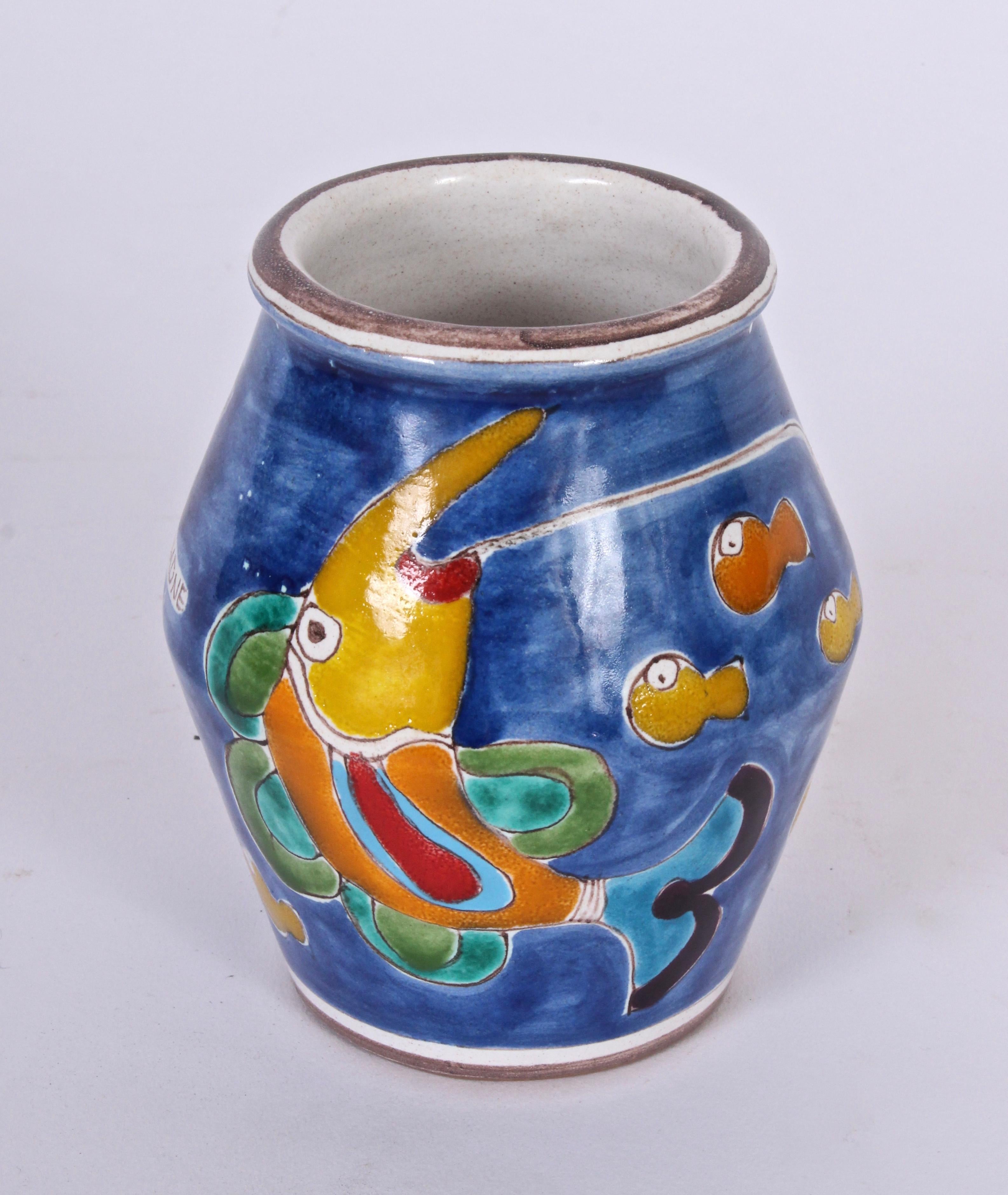 Early, signed Giovanni DeSimone for Vietri hand-painted faience Italian vase. The painted scene depicts a capped man in boat with an underwater world populated by colorful fish. With blue, green, red, orange and yellow coloration. Mediterranean.