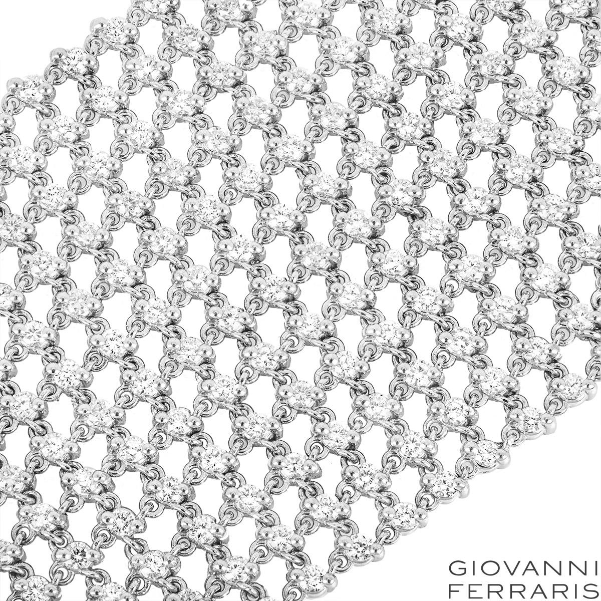 A stunning 18k white gold bracelet by Giovanni Ferraris. The bracelet consists of 12 rows of round brilliant cut diamonds, complemented by a pave set bar clasp. The mesh design bracelet features 648 round brilliant cut diamonds set throughout in a