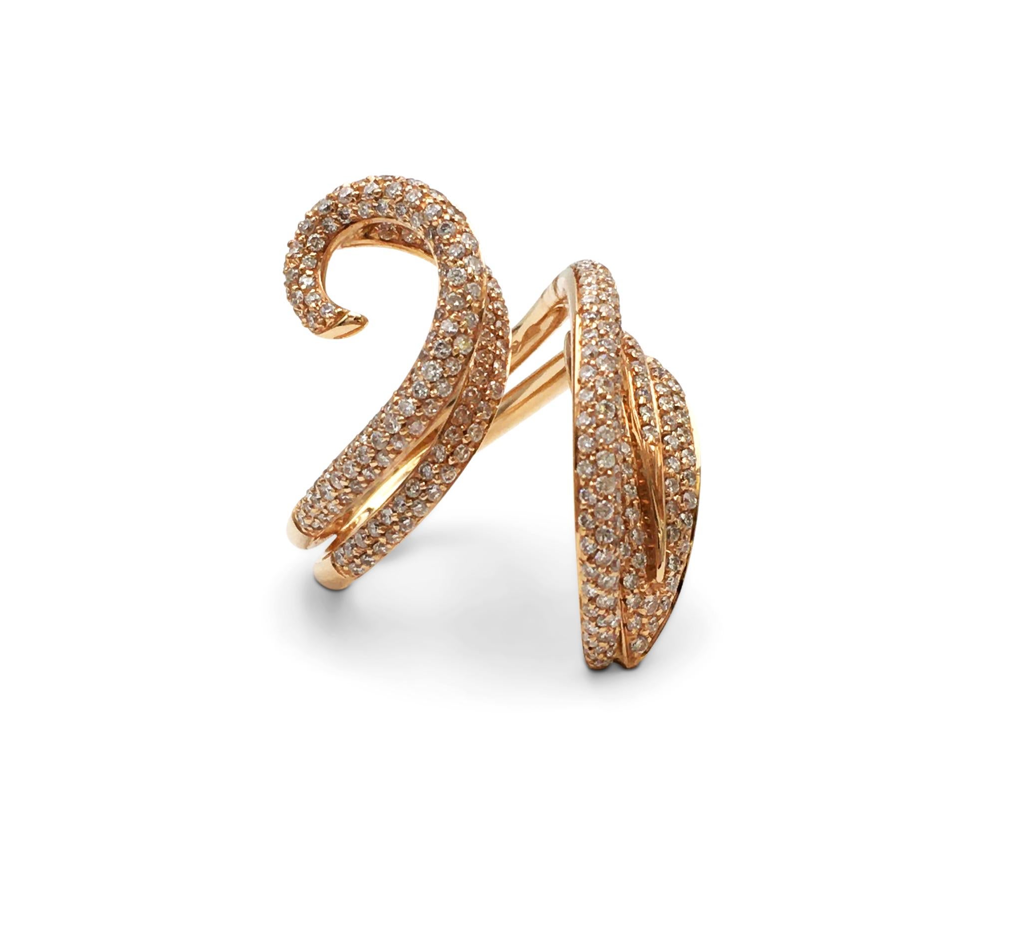 This Giovanni Ferraris crafted in 18 karat rose gold twists elegantly around the finger and set with an estimated 1.50 carats of round brilliant cut diamonds. The ring is not presented with the original box or papers. Signed Gioanni Ferrarus, 750,