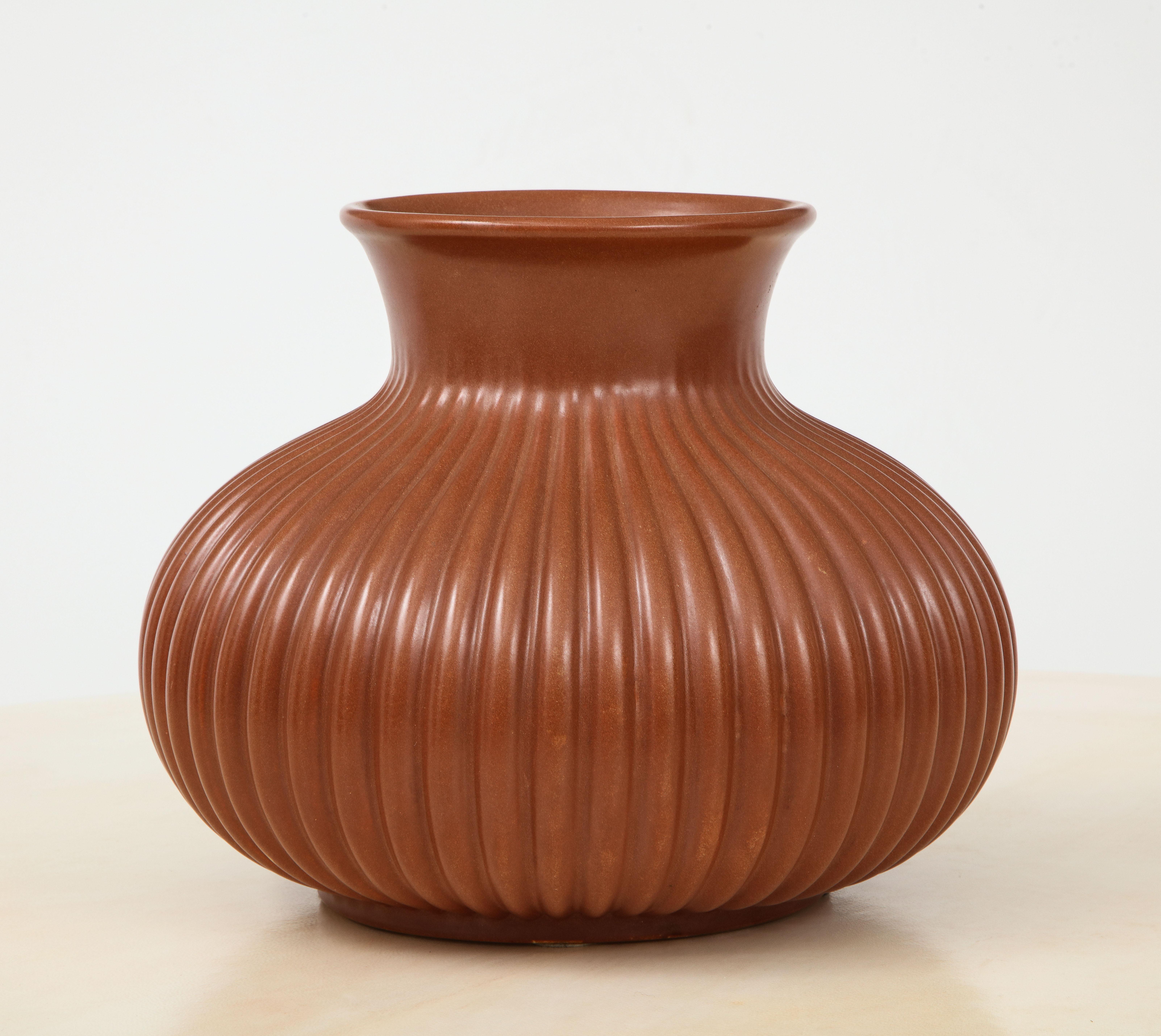 A 1930s Art Deco pottery vase designed by Giovanni Gariboldi for Richard Ginori. Beautifully ribbed carving and wonderful proportions,
Italy, circa 1930
Size: 9 3/4