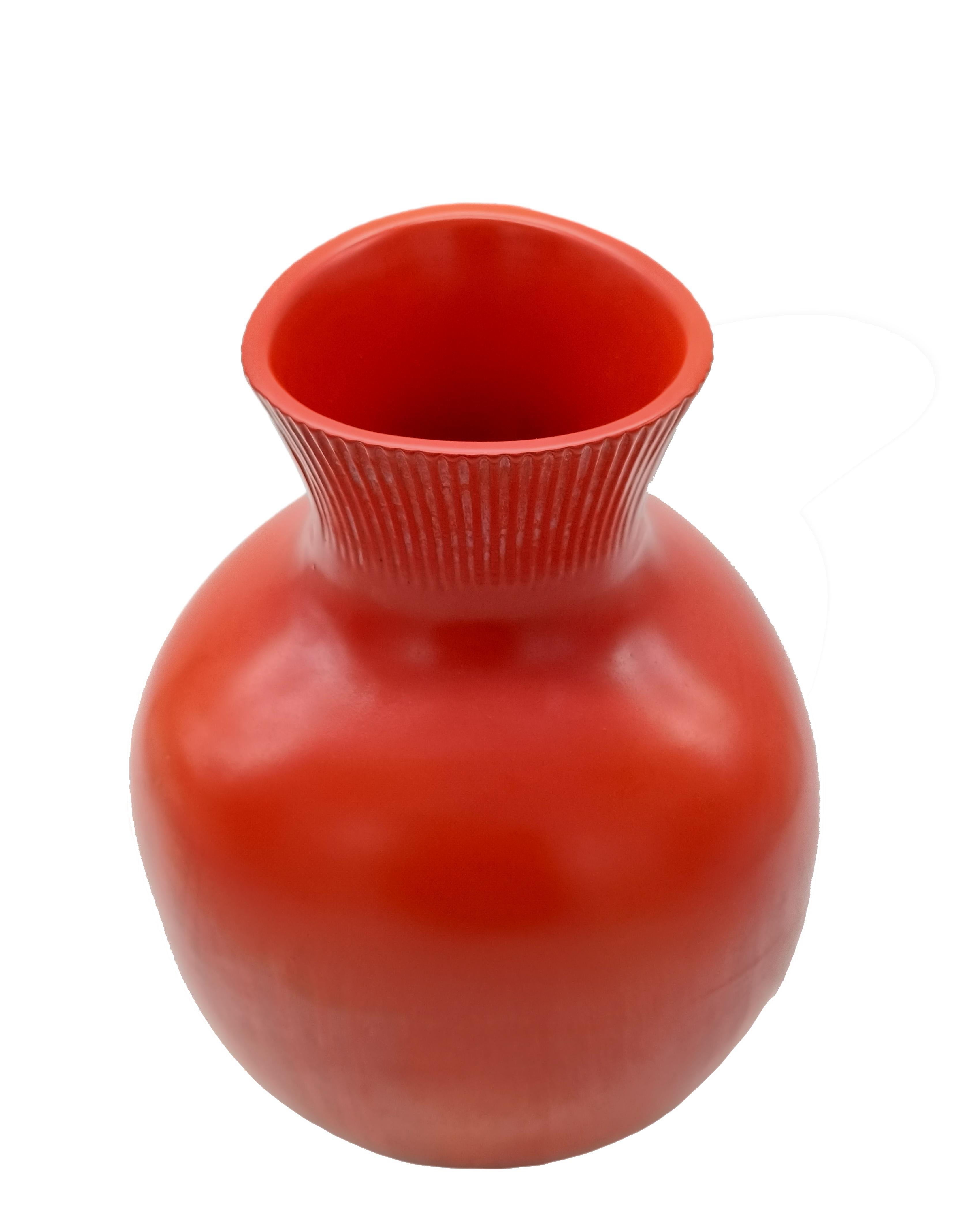 Beautiful and rare orange-coloured glazed ceramic vase with ribbed carvings, designed by Giovanni Gariboldi for the Ditta Richard Ginori - San Cristoforo in the 1930s. Factory mark on the base. 