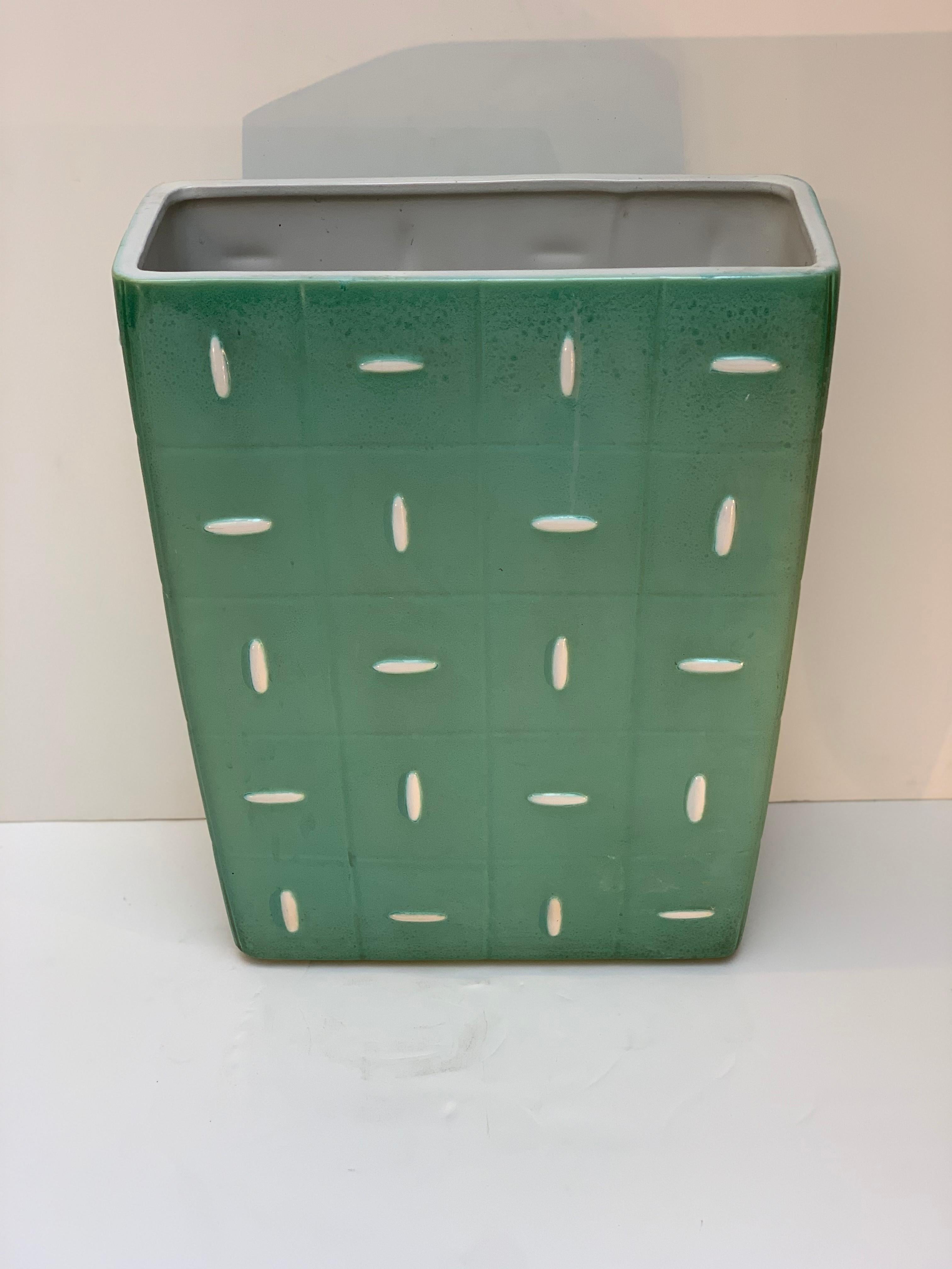 Squared section green and white ceramic umbrella Stand by Giovanni Gariboldi for Richard Ginori S. Cristoforo Milano Italy ,decorated with geometric relief ,signed on the bottom base .
Inside the ceramic umbrella holder is equipped with a removable