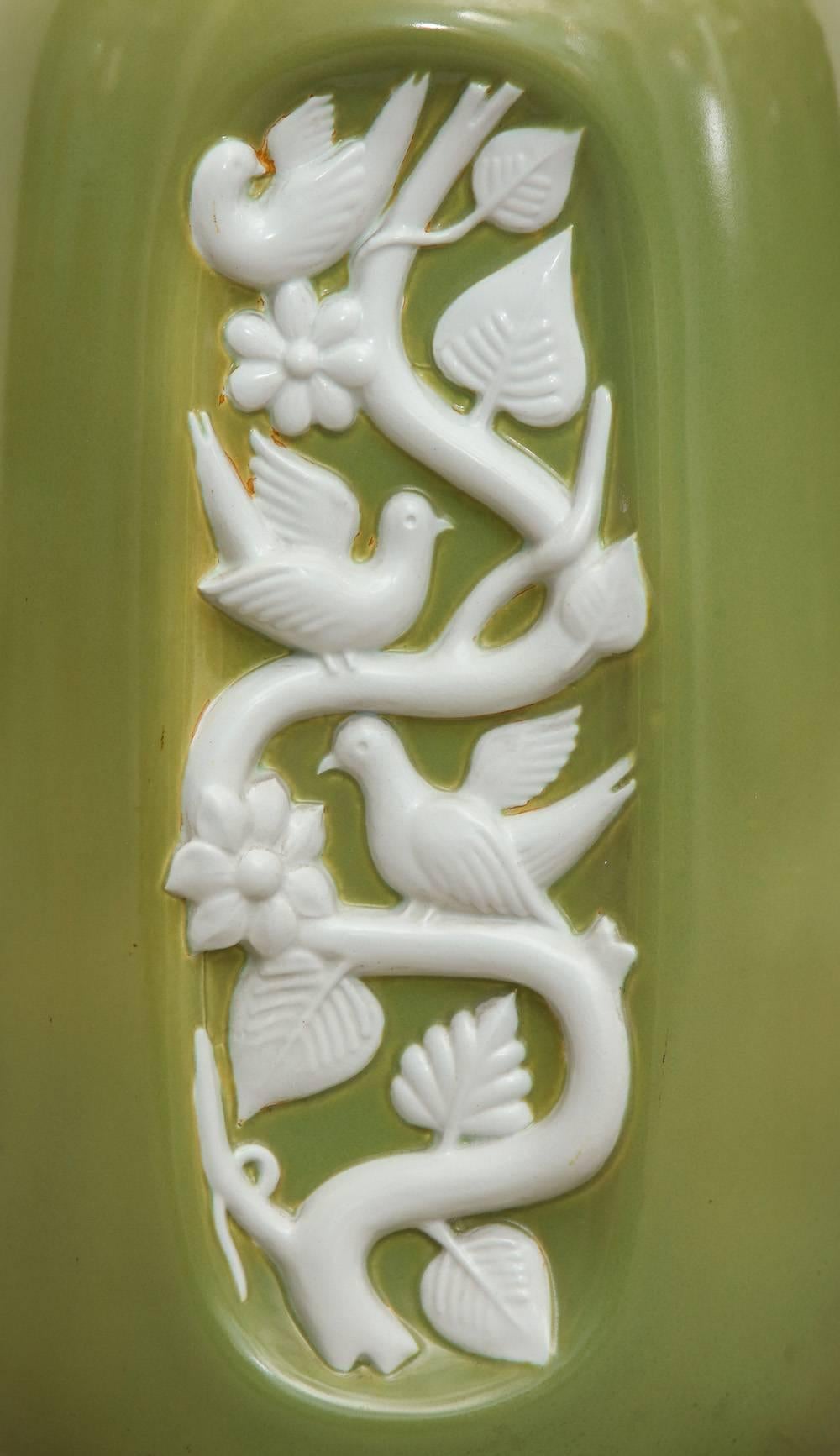 Monumental vase by Giovanni Gariboldi for Richard Ginori.
Fantastic over-scaled porcelain vase with large indent and textured relief of doves on branches. This was created during the period when Gariboldi was the design director of Ginori. Glazes in