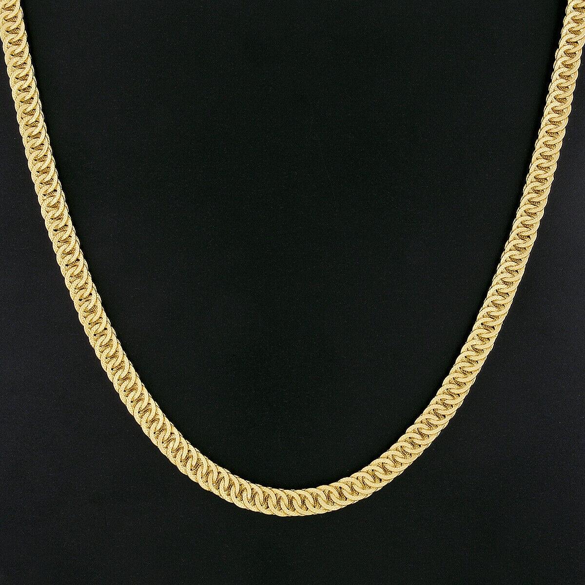 Here we have an absolutely magnificent statement necklace that was crafted in Italy from solid 18k yellow gold. The chain was designed by Giovanni Marchisio and it features very fine and well made, textured circular links that elegantly interlock