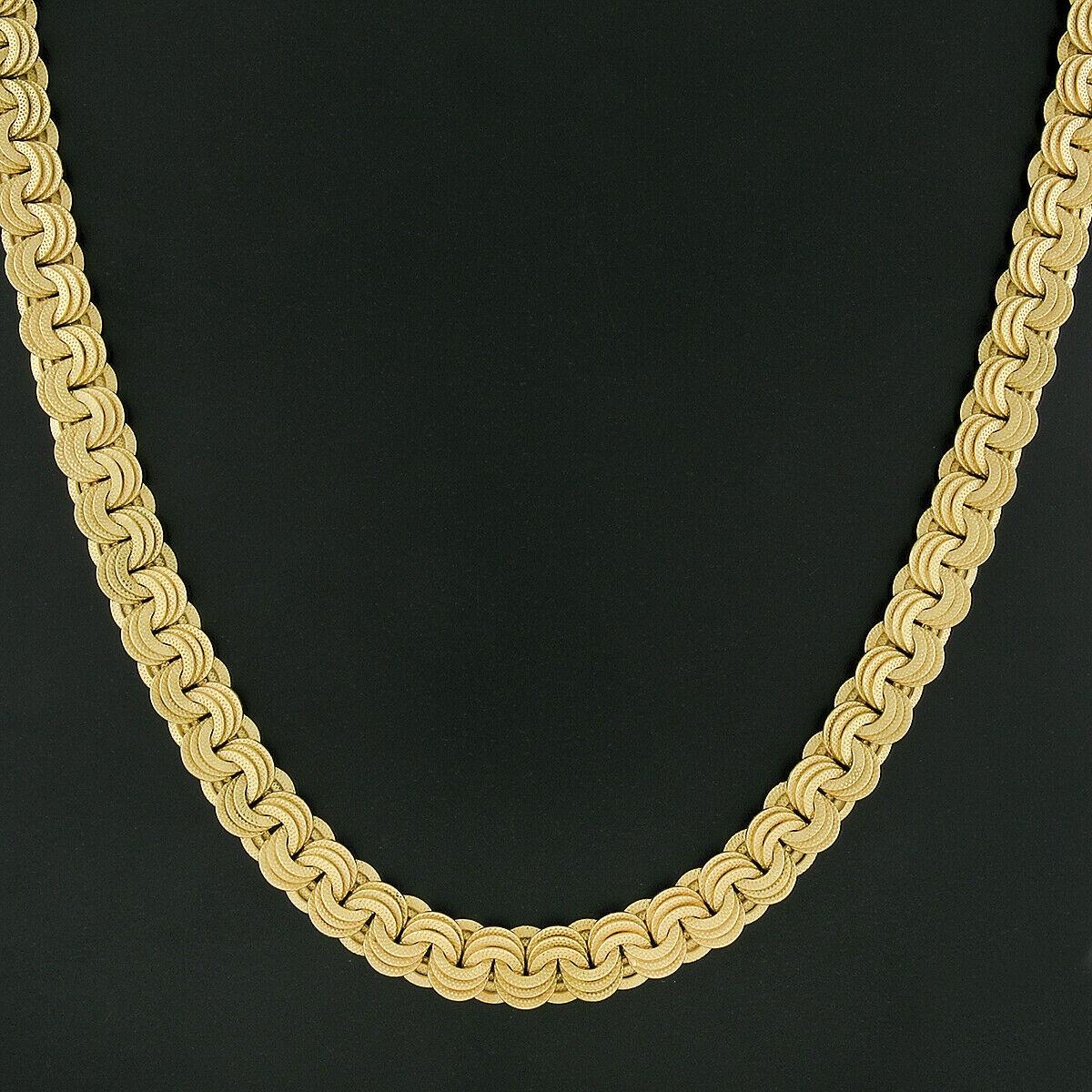 Here we have an absolutely magnificent statement necklace that was crafted in Italy from solid 18k yellow gold. The chain was designed and crafted by Giovanni Marchisio and it features very fine and well made, textured triple circular design links