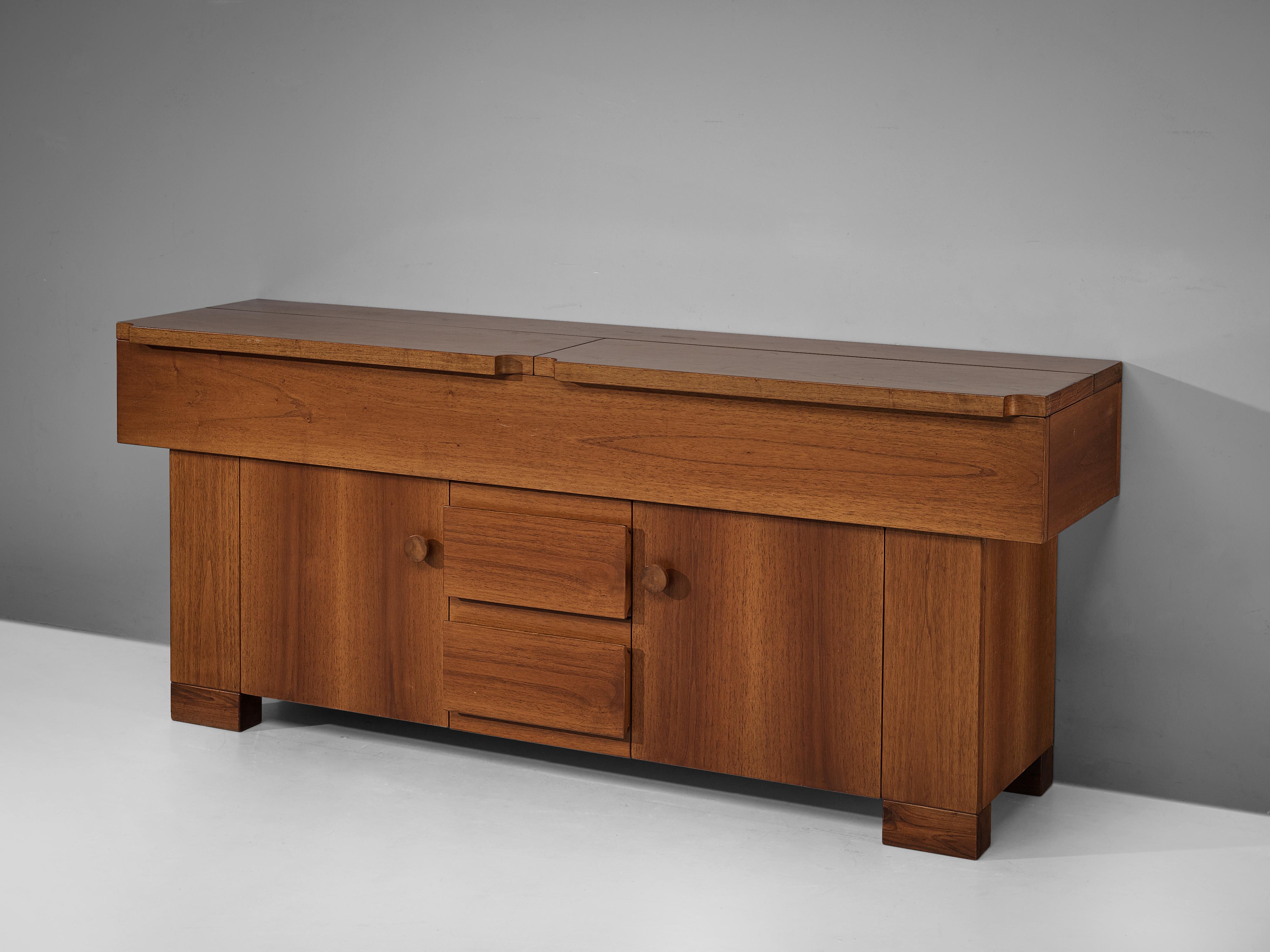 Giovanni Michelucci for Poltronova, ´Torbecchia´ sideboard, walnut, Italy, circa 1964.

This cabinet with its solid and grand appearance is designed by Italian designer Giovanni Michelucci (1891-1990) as part of the 'Torbecchia' series. The clear,