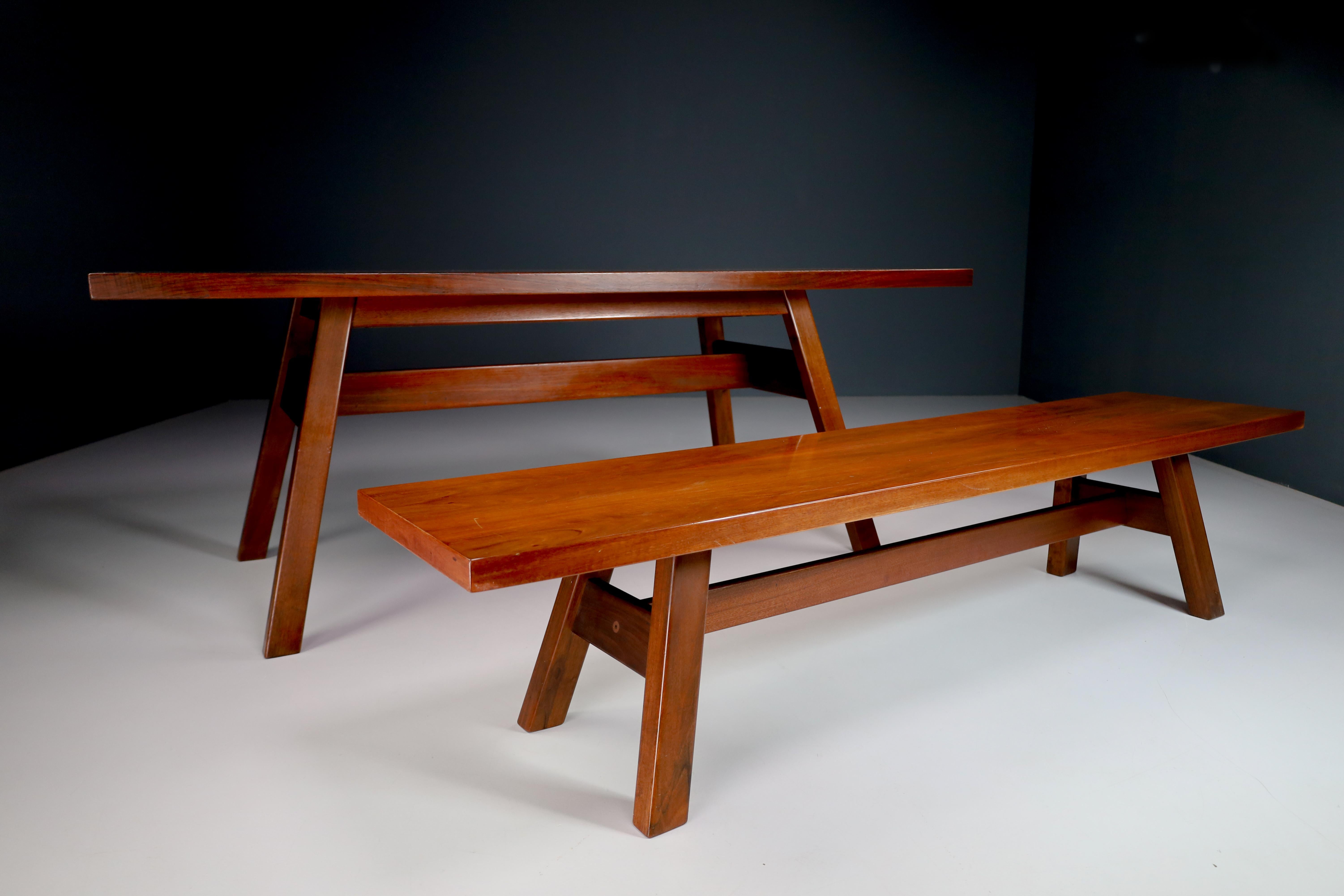 Giovanni Michelucci for Poltronova, 'Torbecchia' Table and Bench in walnut, circa 1964.

Walnut table and a bench; this set is designed by Italian designer Giovanni Michelucci (1891-1990) as part of the 'Torbecchia' series. The design is based on a