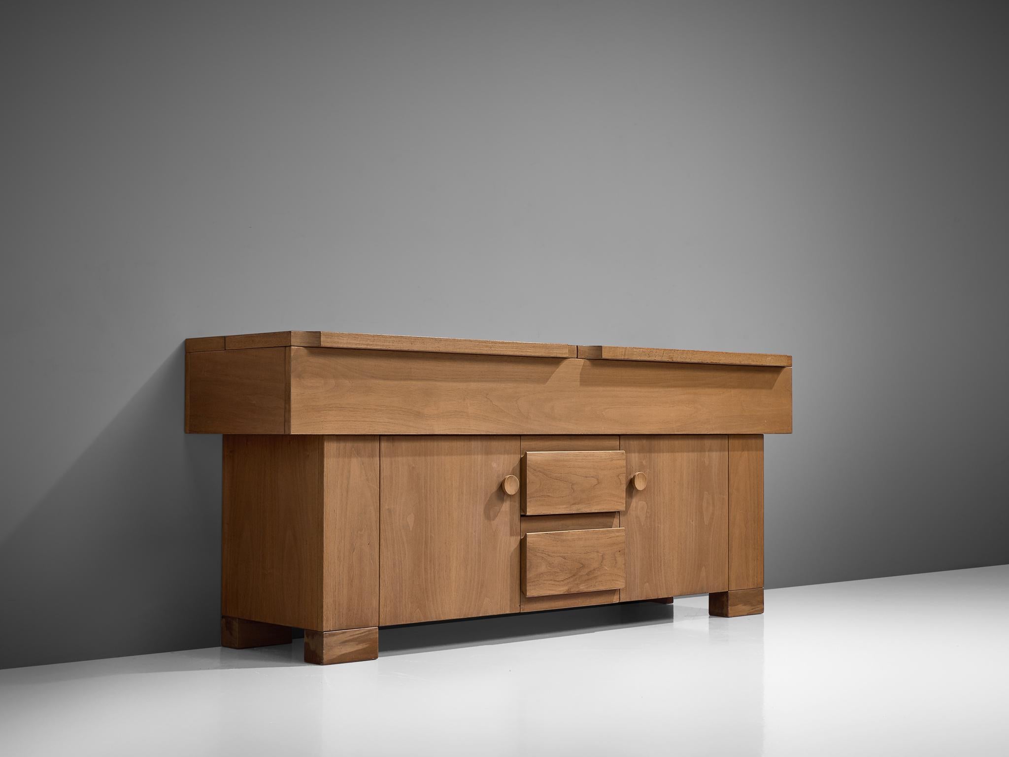 Giovanni Michelucci, sideboard, walnut Italy, 1964

This cabinet will brighten up your interior through its solid and grand appearance. It is a stunning cabinet in beautiful teak. The horizontal and vertical lines give it an architectural