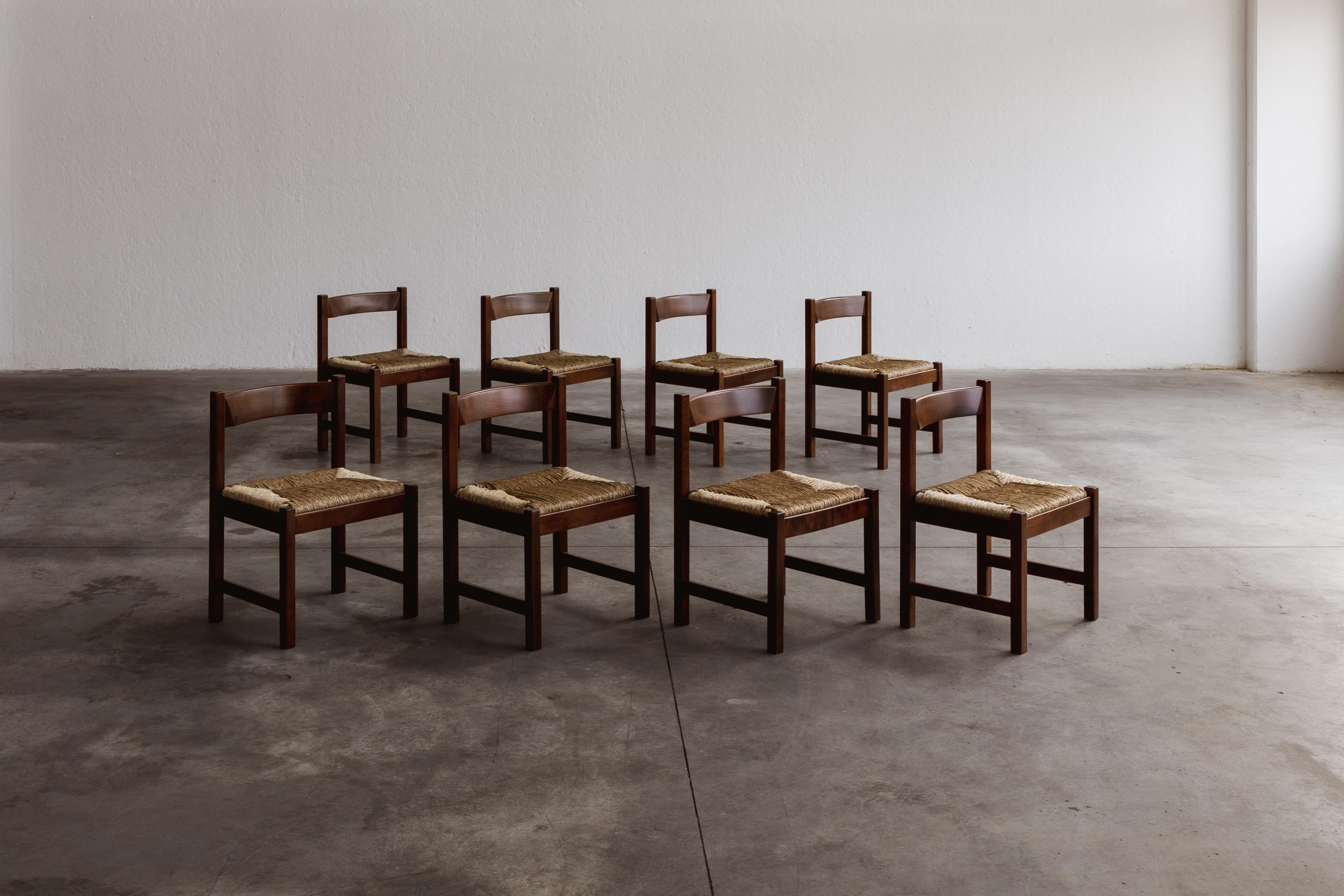 Giovanni Michelucci “Torbecchia” Dining Chairs for Poltronova, Italy, 1964, set of eight.

Crafted from dark-stained beechwood with woven straw seats, the 
