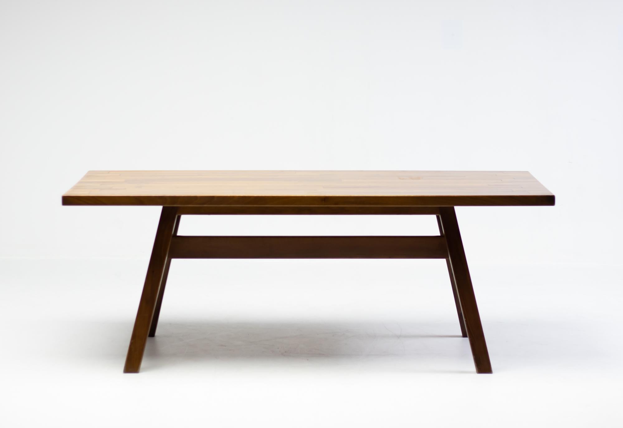 Table from the Torbecchia series, designed by brutalist architect Giovanni Michelucci for Poltronova, 1964. 
Solid walnut structure with beautiful table edge detail similar to Charlotte Perriand tables. 
This architectural piece will enlighten