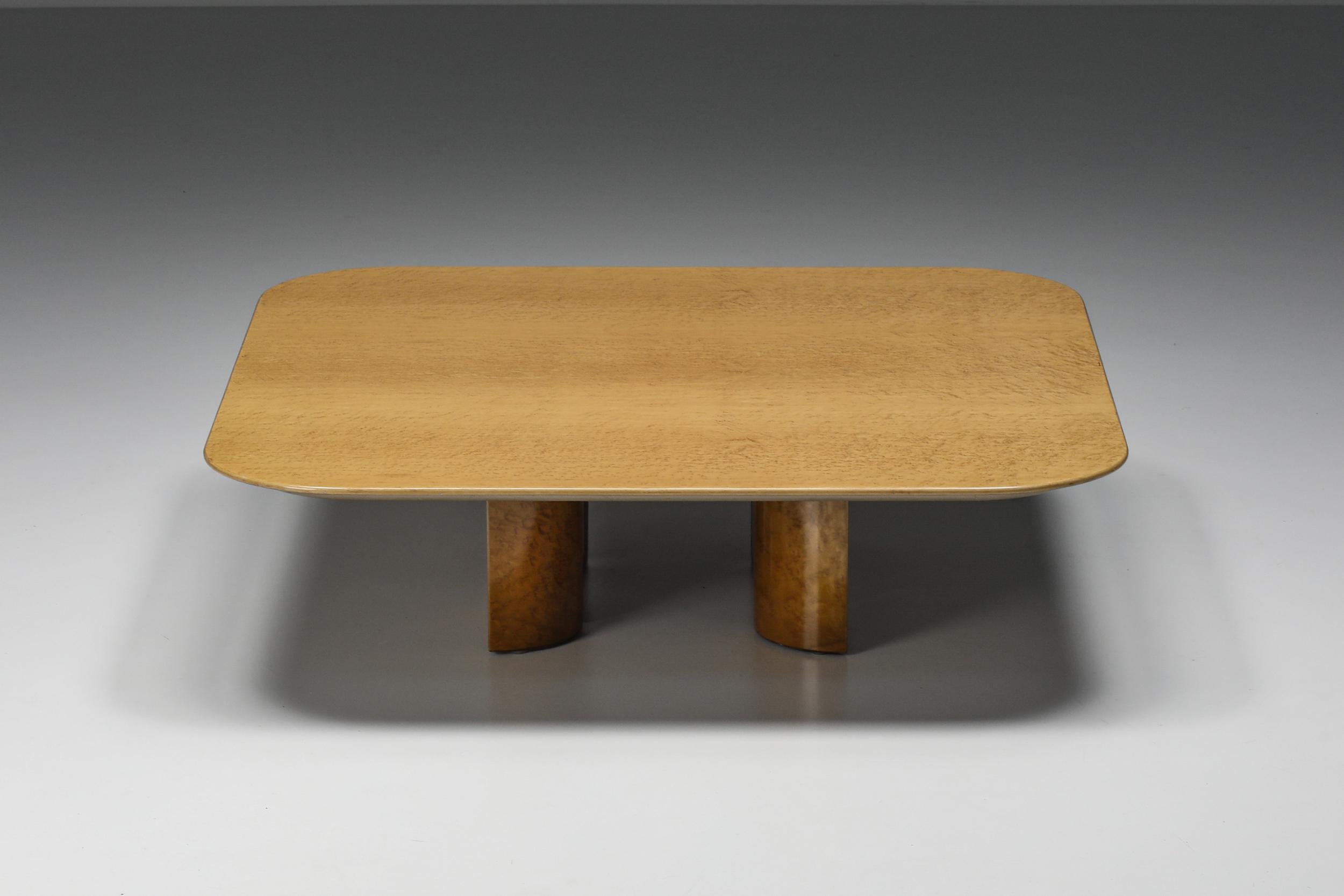 Saporiti, bird's-eye maple veneer coffee table by Giovanni Offred; 

Postmodern square coffee table by high-end manufacturer Saporiti, Italy, the 1980s. The design of the base is an inside-out circle divided into four parts.

 