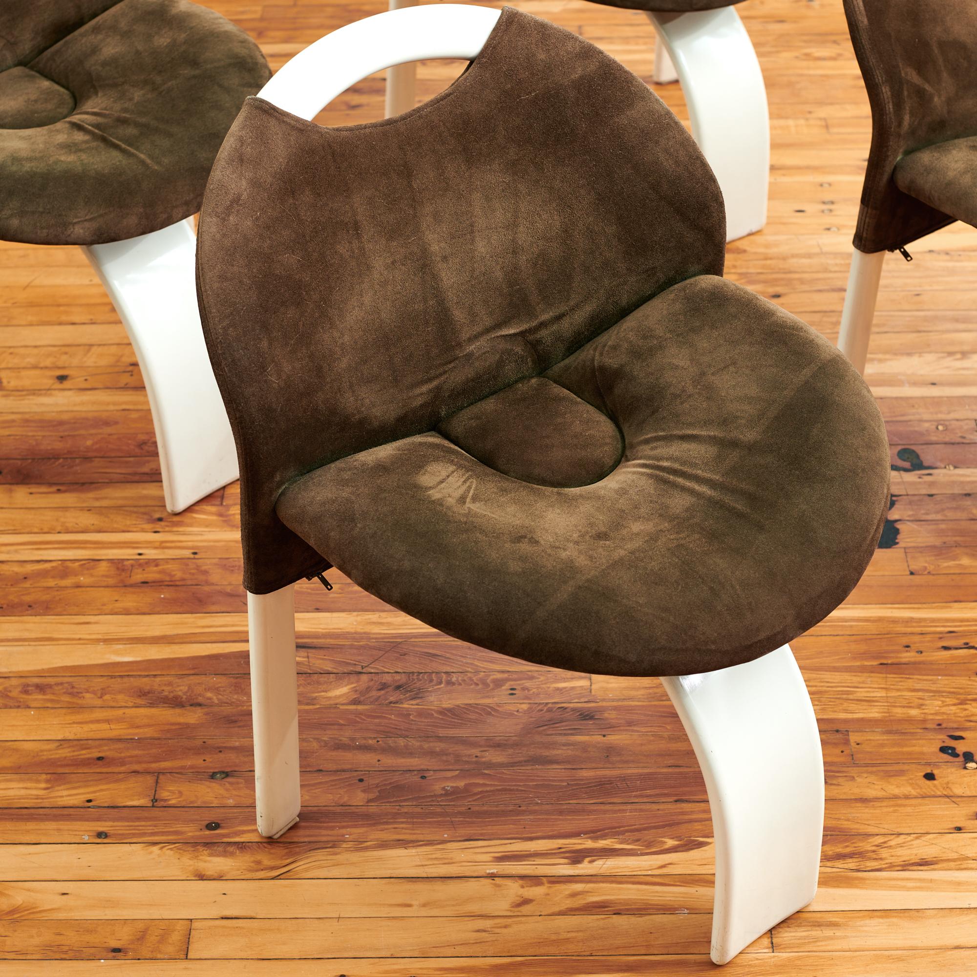 Giovanni Offered for Saporiti, circa 1970s set of four brown velvet dining chairs. The original chocolate alcantara suede is pulled tight over sculptural lacquered wooden frames. Playful and expressive, these challenge the idea of what a dining