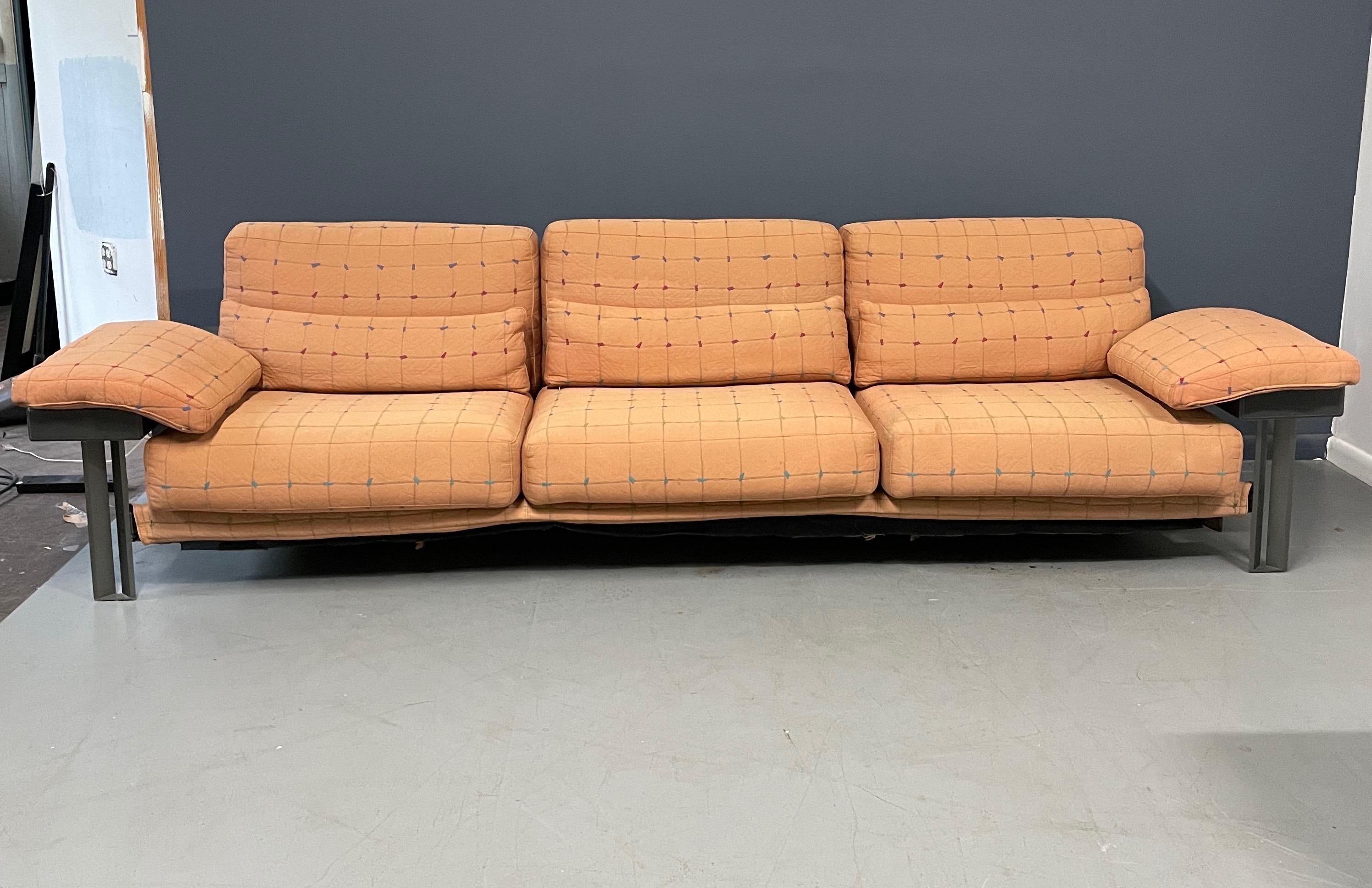 This Saporiti sofa in it's original fabric is meticulously constructed of stainless steel, burl panels and leather arms and full back. This item needs to be reupholstered. We can reupholster this sofa in COM. We can also also reconstruct the back
