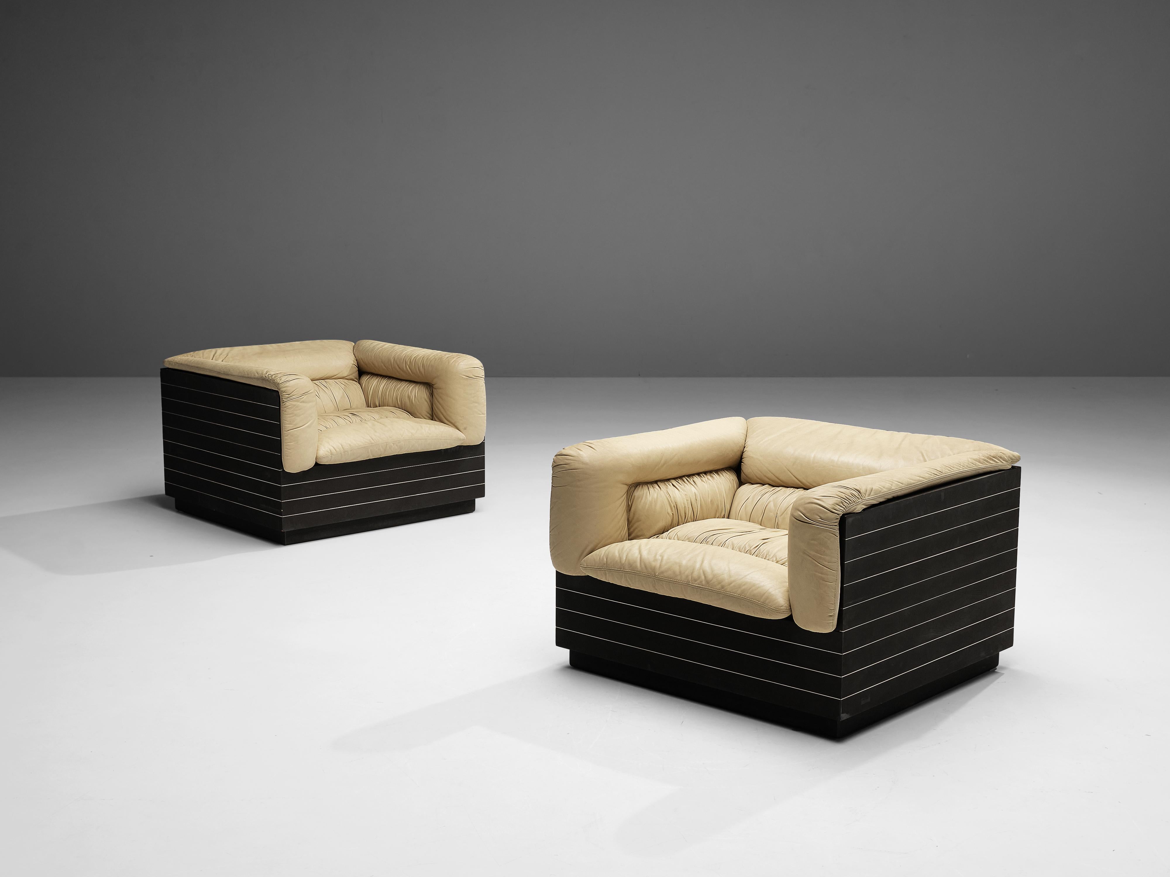 Giovanni Offredi for Saporiti, lounge chairs, leather, wood, metal, Italy, 1970s

Cubic pair of lounge chairs designed by Giovanni Offredi. Offredi. This design features thick leather cushions into a cubic black frame. The wooden frame is structured