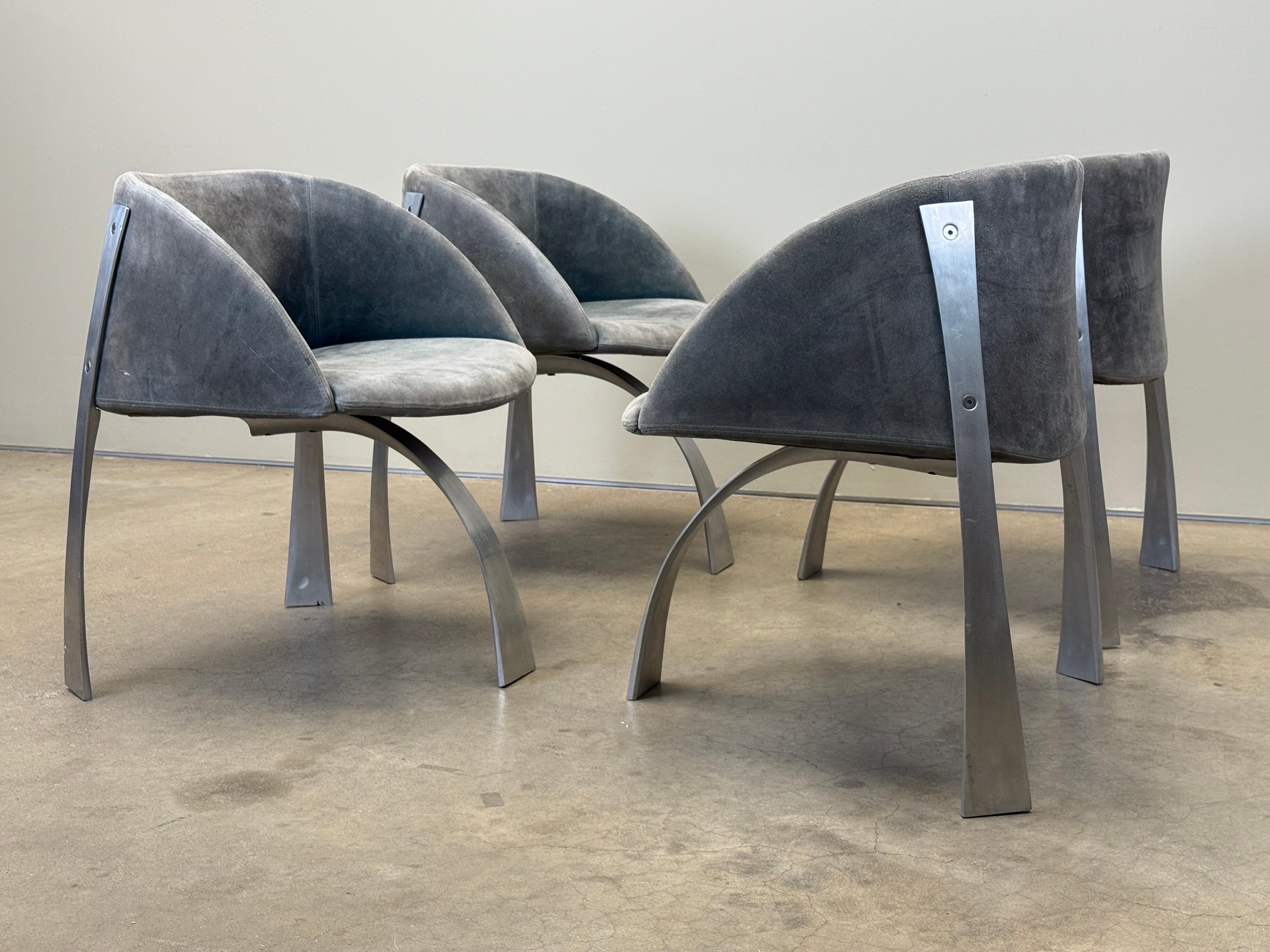 A set of four P80 armchairs deigned by Giovanni Offredi for Saporiti Italy in 1973. Original patinated grey / green suede upholstery. 