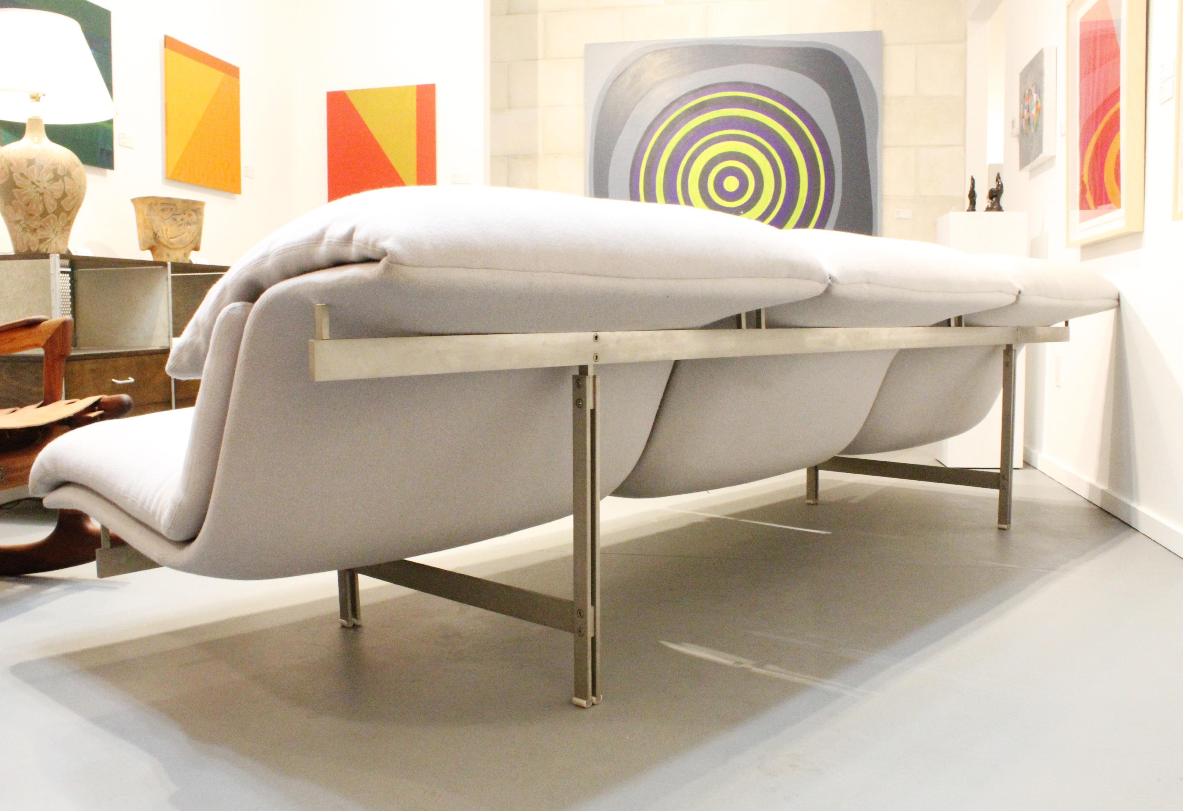 Incredible Wave sofa designed by Giovanni Offredi for Saporiti Italia. This model is a rare and hard to find large model which is 112 inches long as opposed to common 96 inch version. Sofa is in excellent vintage condition and has a beautiful light