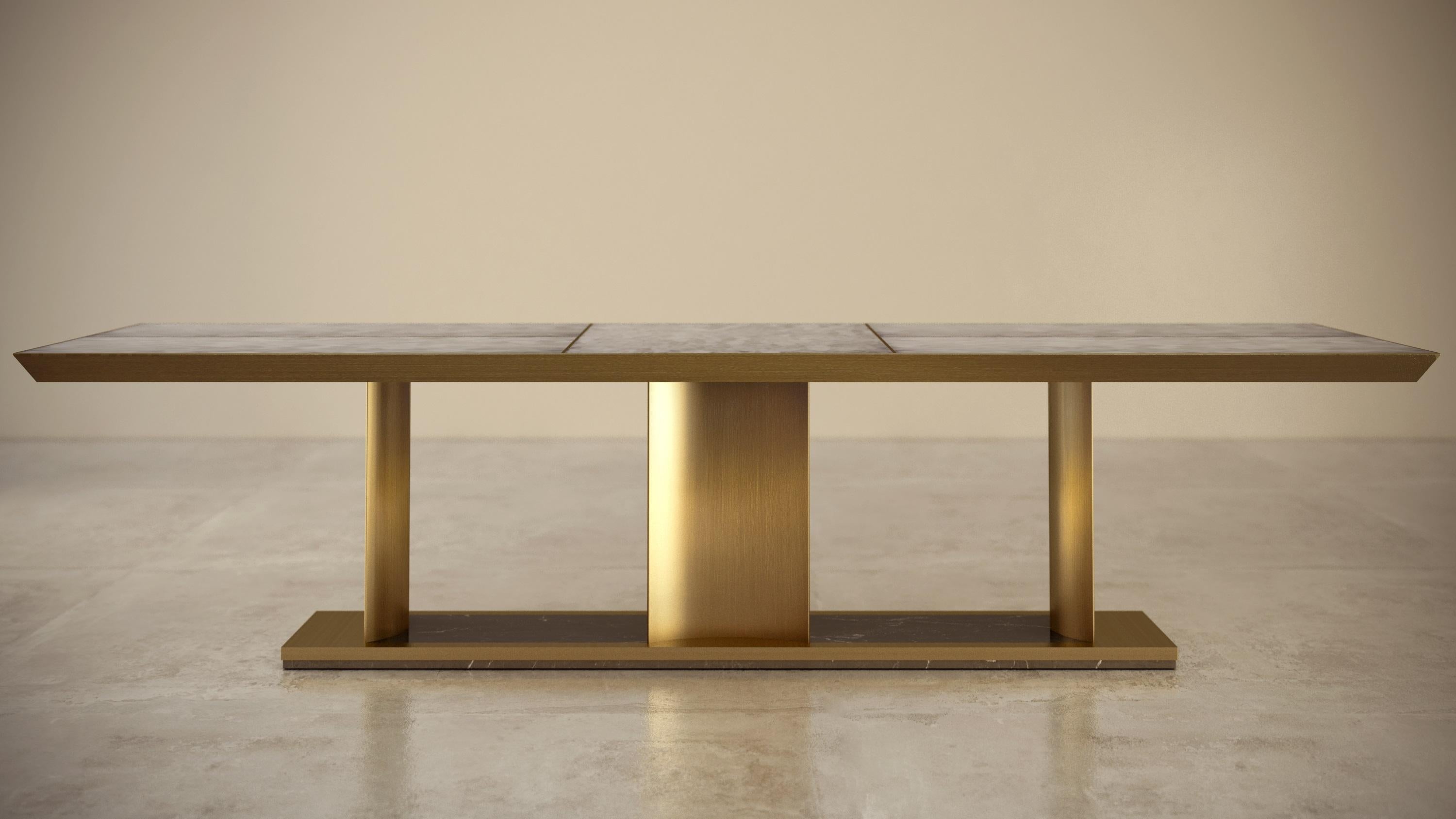 Dining table composed in marble and metal brass finishing, created by Michele Arcarese Architect together with Giovannozzi.
- Top with beveled edge in flush marble type 
