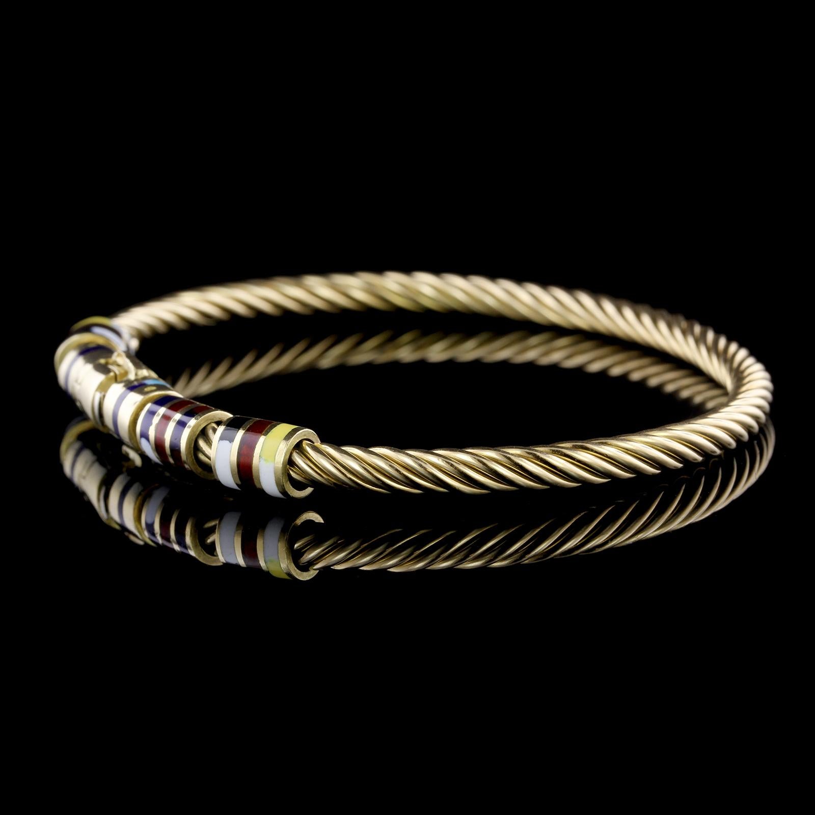 Giovepluvio 18K Yellow Gold Enamel Nautical Bangle. The bracelet is designed
as a ropetwist bangle with various colored enamel rondelle accents, interior
circumference 7 1/4