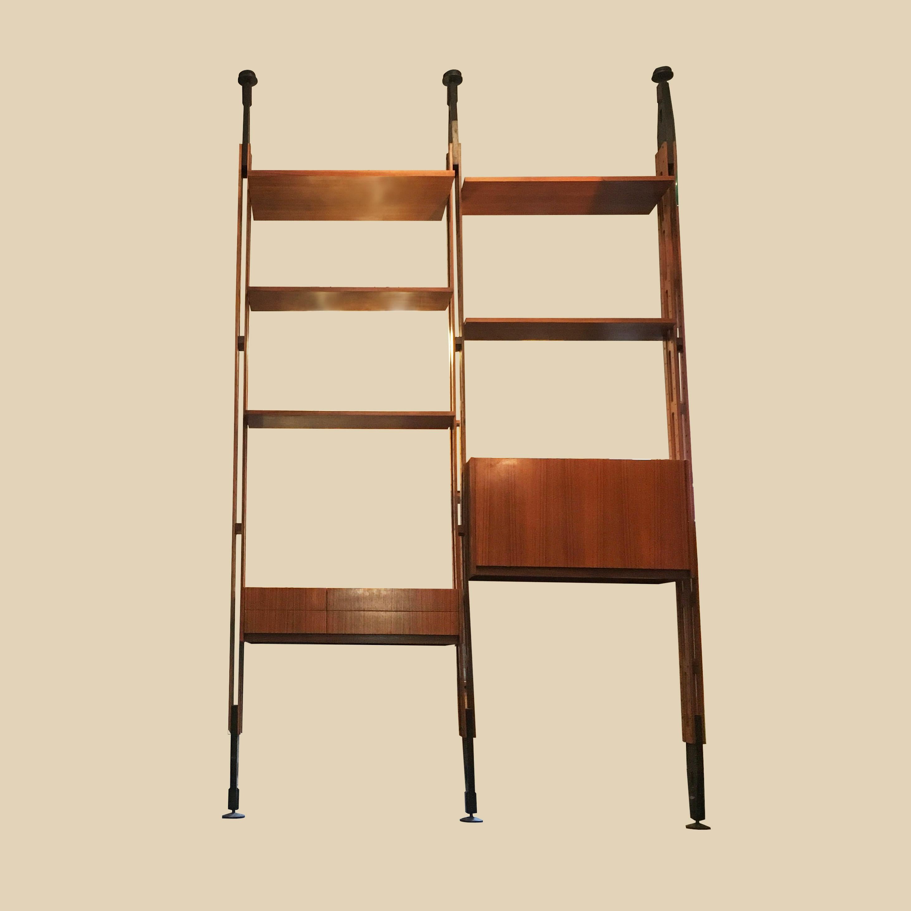 Giraffa bookcase created in the 1962 by Paolo Tilche for Arform. Wooden uprights, black painted wood terminals, adjustable black plastic terminals. 5 shelves and a container with flap door in veneered wood and a written module with 4 asymmetrical