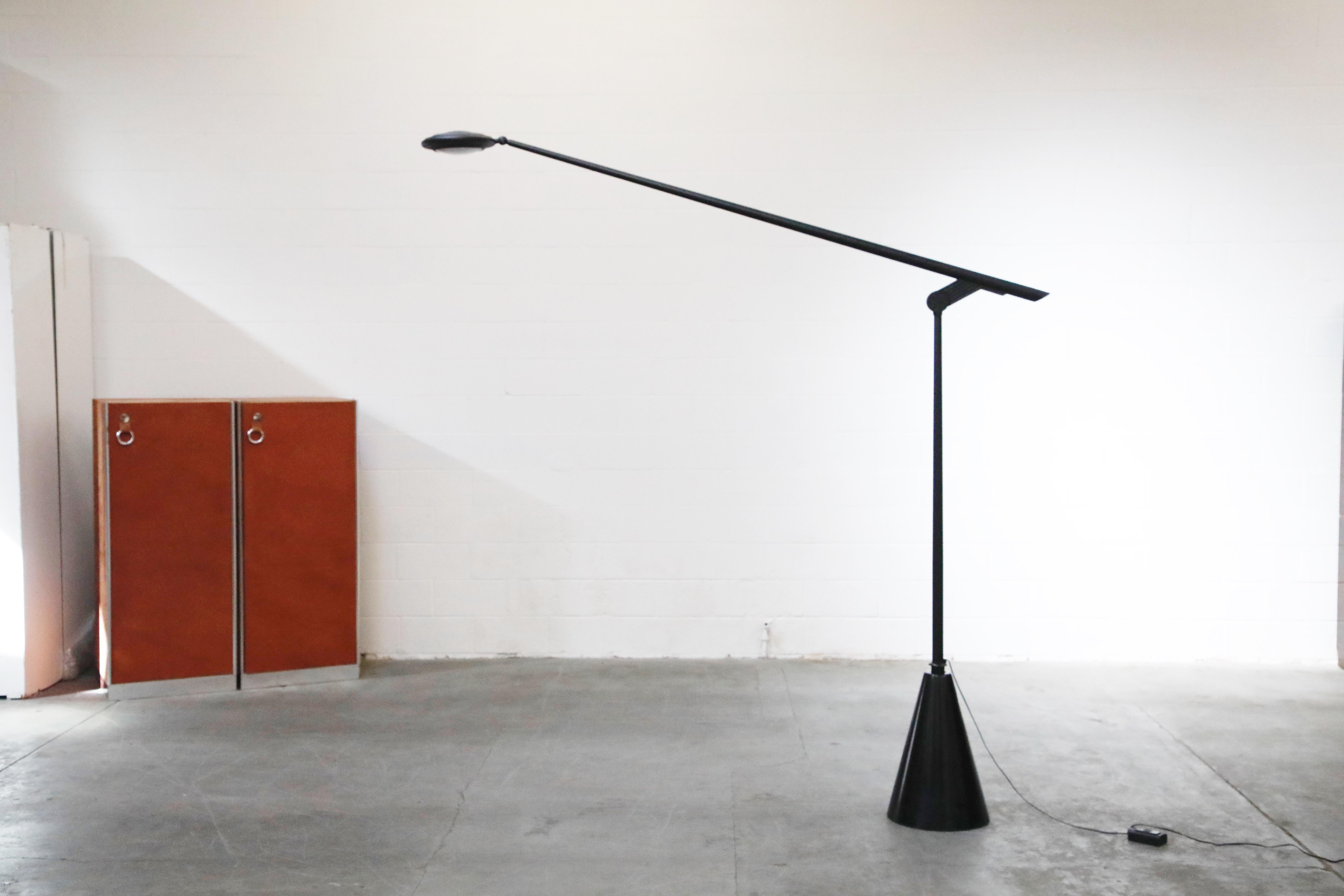 This rare Postmodern monumental 'Giraffa' floor lamp, designed and produced in 1985 for a short time, by Hans Von Klier for Bilumen features a conical granite base with matte black post and swivel arm with adjustable diffuser.

Such incredible