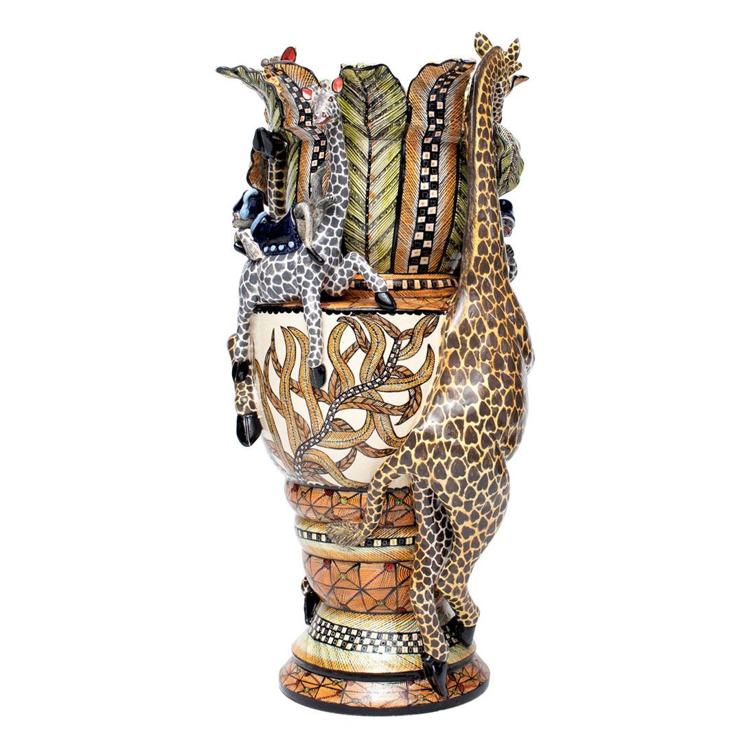 Giraffe Vase: Hand-Painted by Winnie Mchunu and Sculpted by Sfiso Mvelase

The Giraffe Vase is a breathtaking example of South African ceramic artistry, created by the talented artisans at Love Art Ceramic in 2024. This stunning piece stands 17