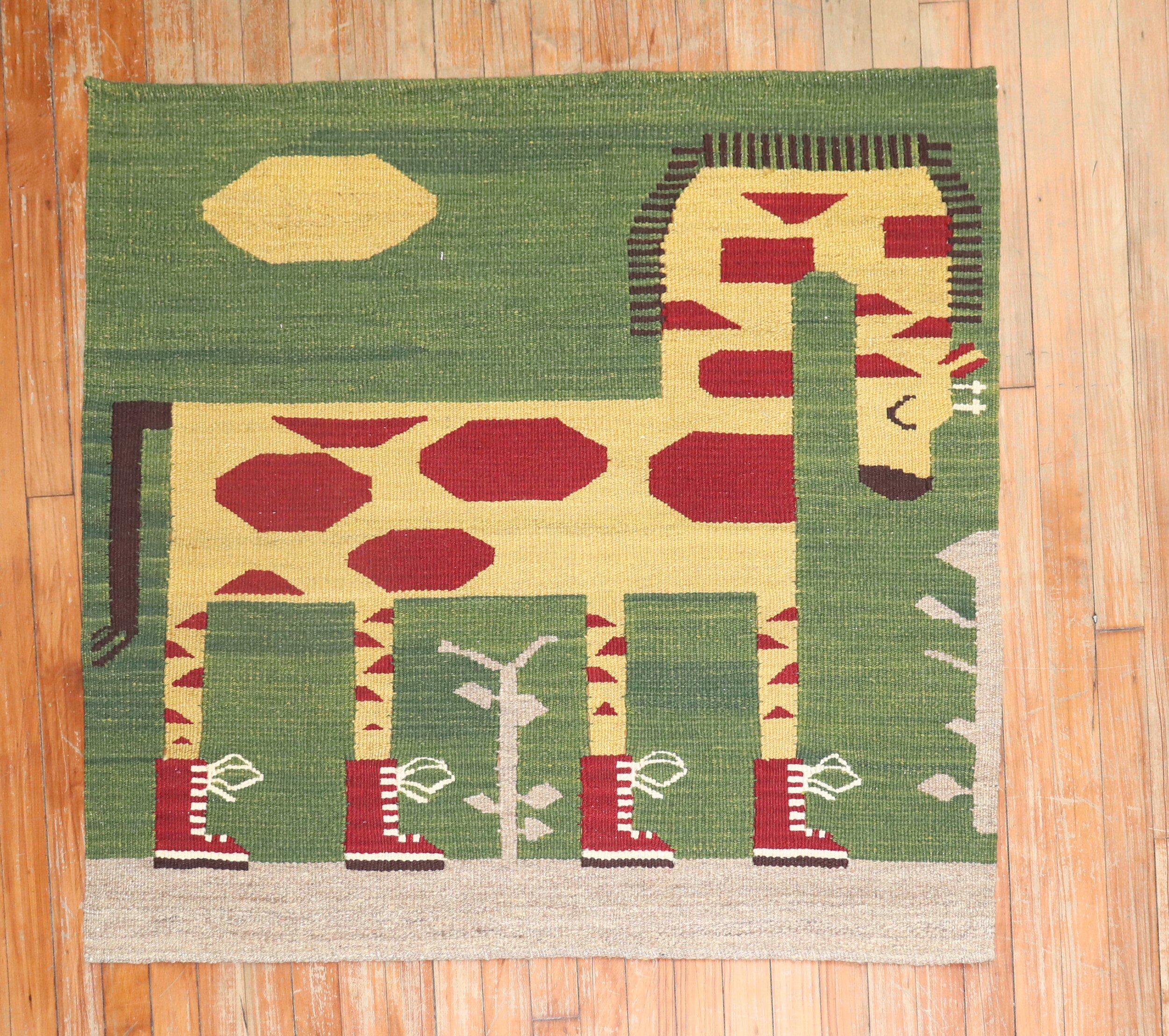 Scatter size Persian Kilim from the late 20th century with a sad giraffe on a green field. Look at those boots though!

This was originally belonging to a private Persian collector who requested to make a custom collection of flat-weaves with