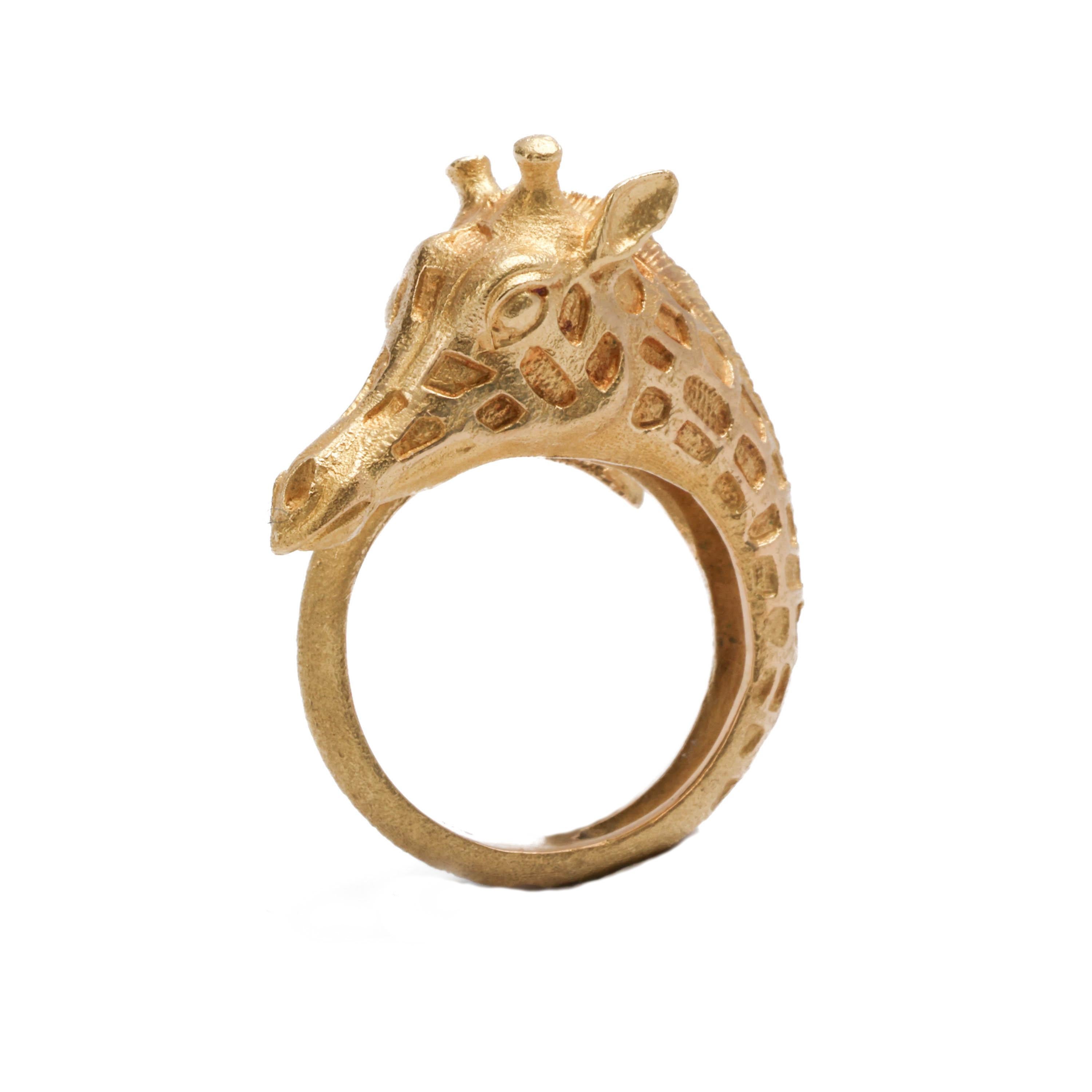 This giraffe ring is fully hallmarked with Swiss gold assay marks along with the Patek Phillippe maker's mark and was most likely created by Gilbert Albert. The ring is reflective of the work Albert was doing in watchcase and jewelry designs during