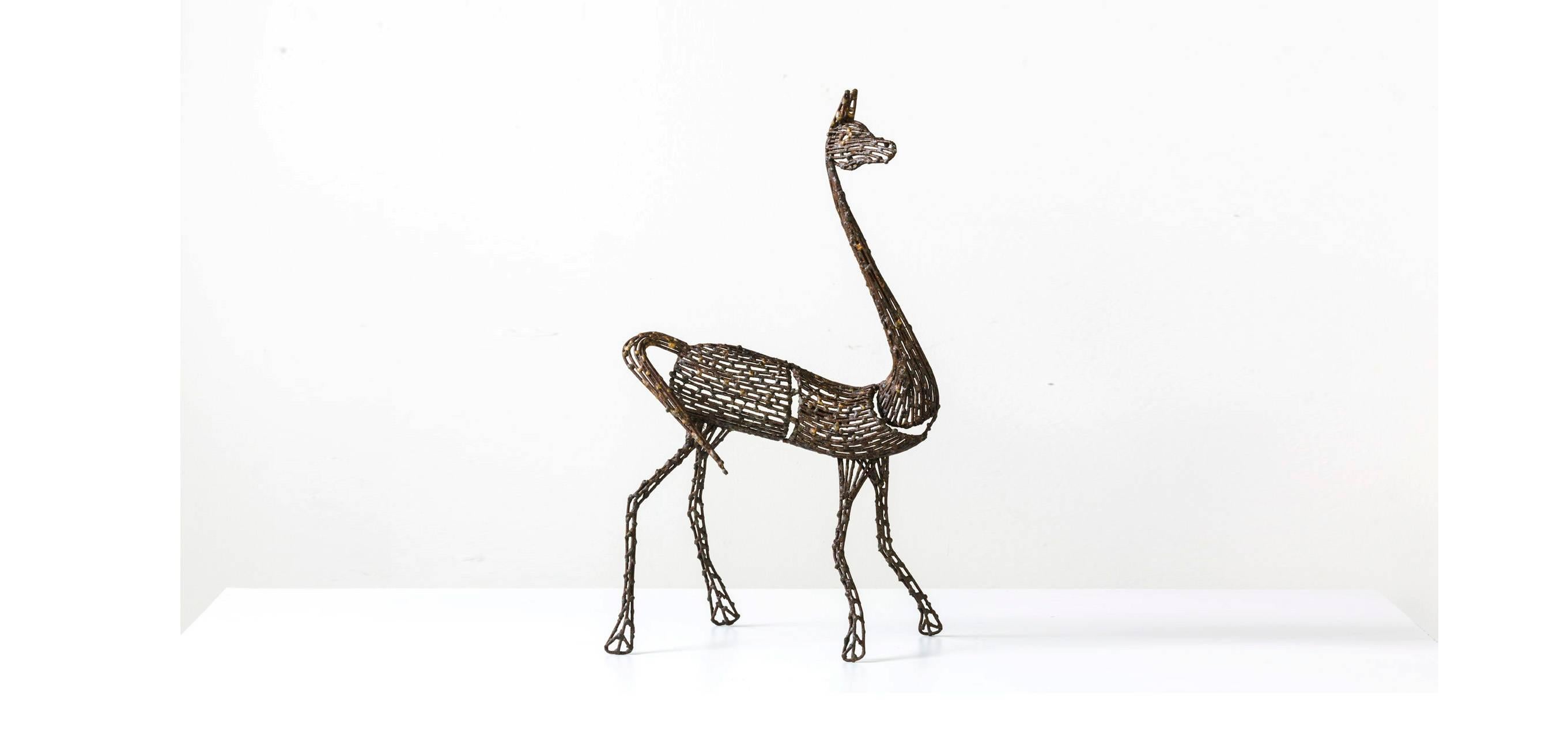 Giraffe sculpture by Salvino Marsura, hand welded from individual fragments of steel rod and finished in baked powder colored pigments. Extremely intricate metal work.
Made in Italy.