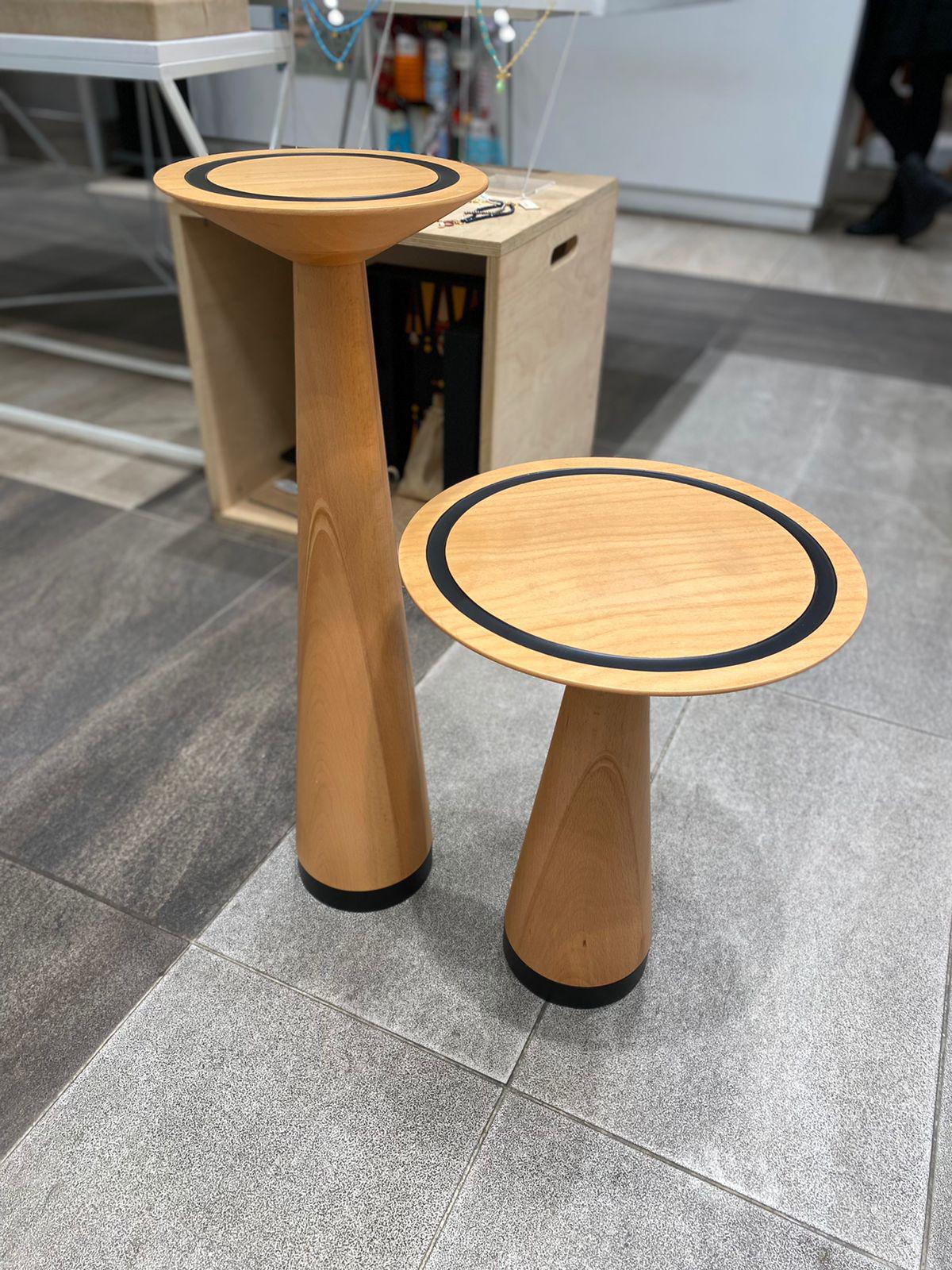 The Set Is Made of 2 units made out of beech wood with black powder coated metal finish. The dimensions of the tables are studied in proportion of size and harmony of material to give the piece an artistic identity that surpasses time and space. The