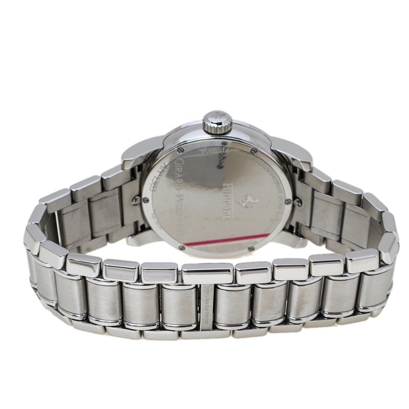 This Girard Perregaux Ferrari Men's Wristwatch is a blend of simplicity and intricate engineering. The black dial houses luminescent Arabic numerals, luminous hands and a seconds sub-dial. The stainless steel case bears a self-winding crown. Crafted