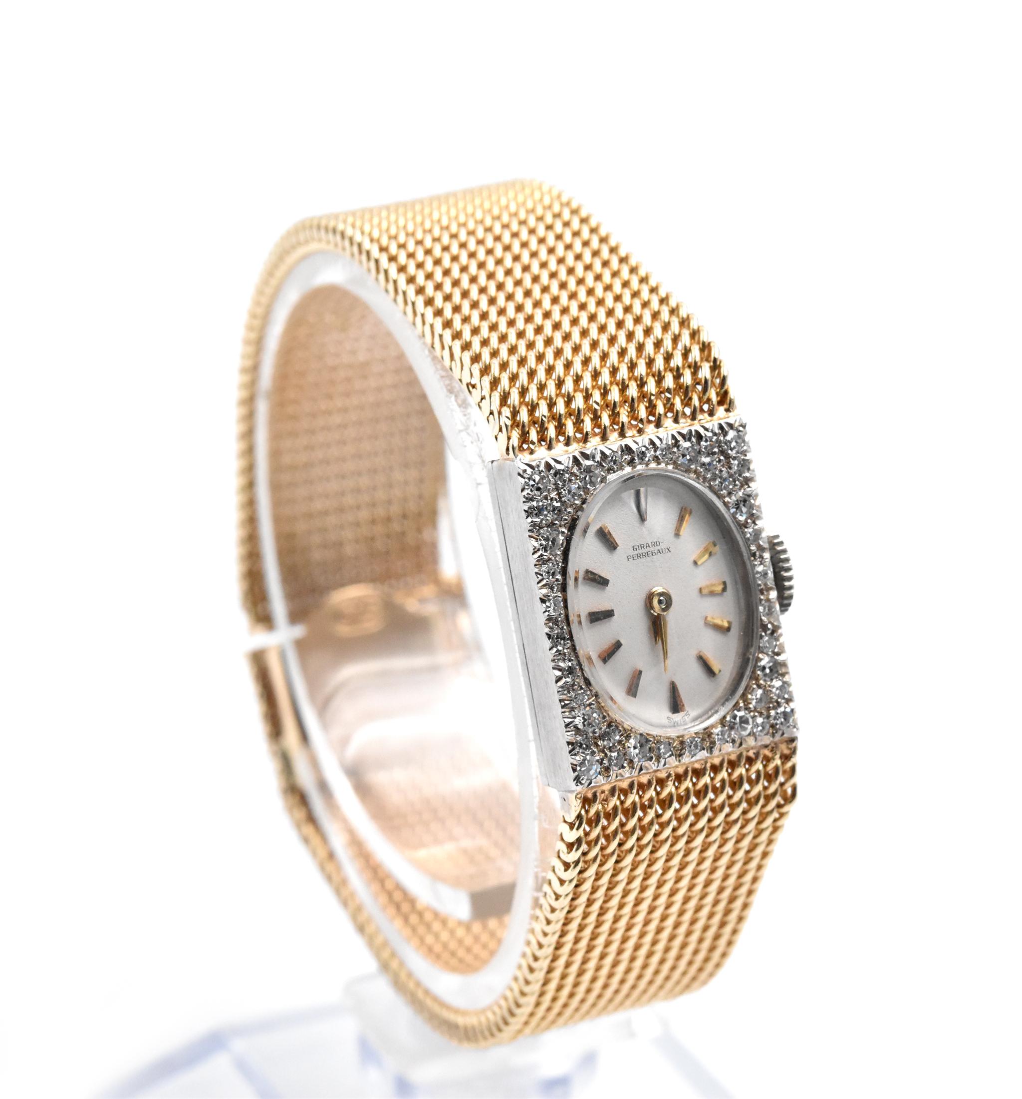 Movement: manual wind
Function: hours, minutes
Case: 18x14mm rectangle, 14k white gold case with diamond bezel, plastic crystal
Band: 14k yellow gold band with box and tongue clasp 
Dial: white dial with gold diamond markers and gold