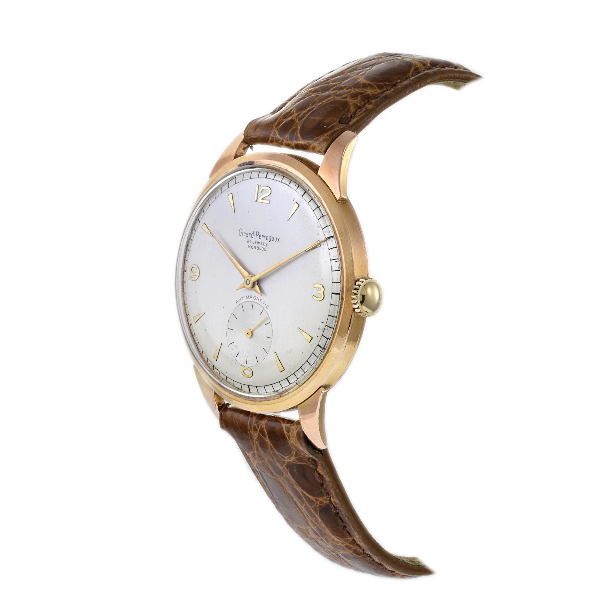 VINTAGE 1950'S GIRARD-PERREGAUX Calatrava 38MM 18KT ROSENGOLD-GEHÄUSE, silbernes ZIFFERBLATT MIT PFEIL UND ARABISCHEN MARKIERUNGEN, UNTERZEITZEIGER ZWEITZEIG, HANDAUFZUG 21 JEWEL GP-Uhrwerk Kaliber 03B. Entdecken Sie mit dieser Uhr von