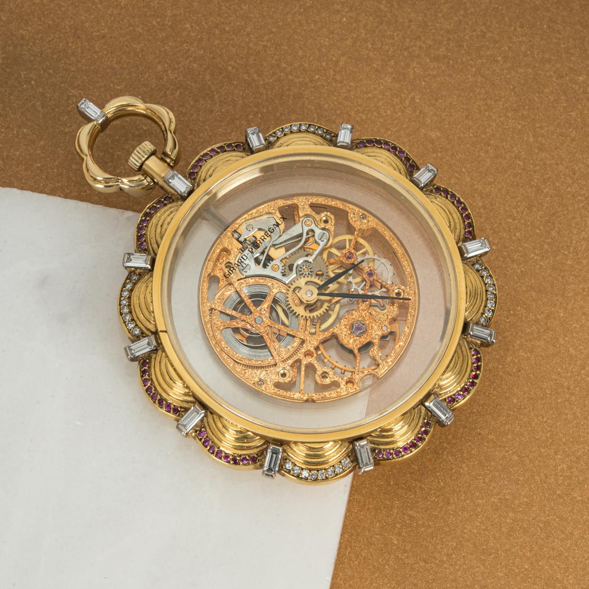 Girard Perregaux. A Rare Gold Skeleton Diamond & Ruby Set Keyless Lever Pocket Watch C1960s

Dial: The dial is the glass which is signed Girard Perregaux, as this is a skeleton pocket watch. The diamond markers on the edge of the case are the hour